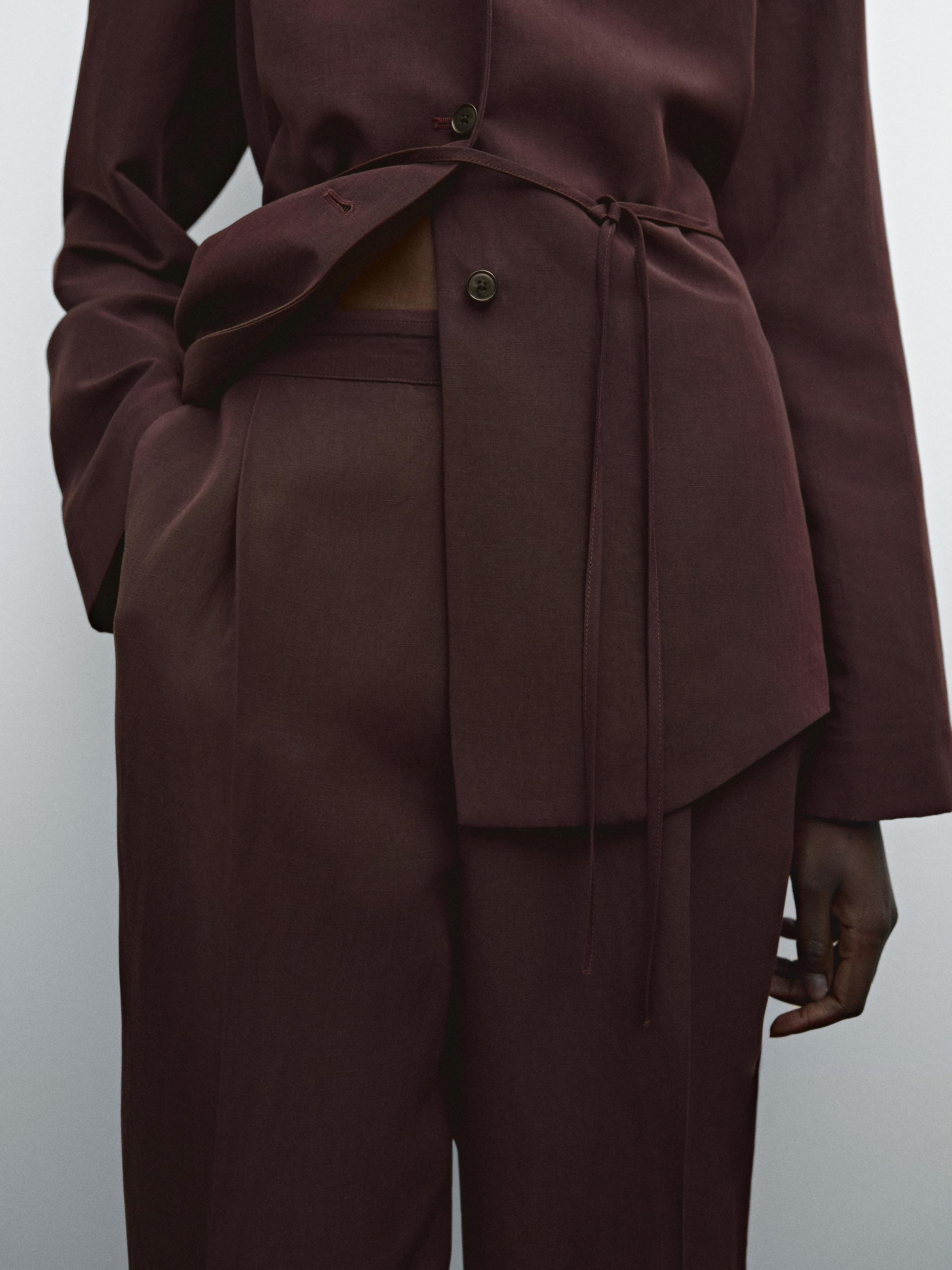 Flowing trousers with darts and thin waistband