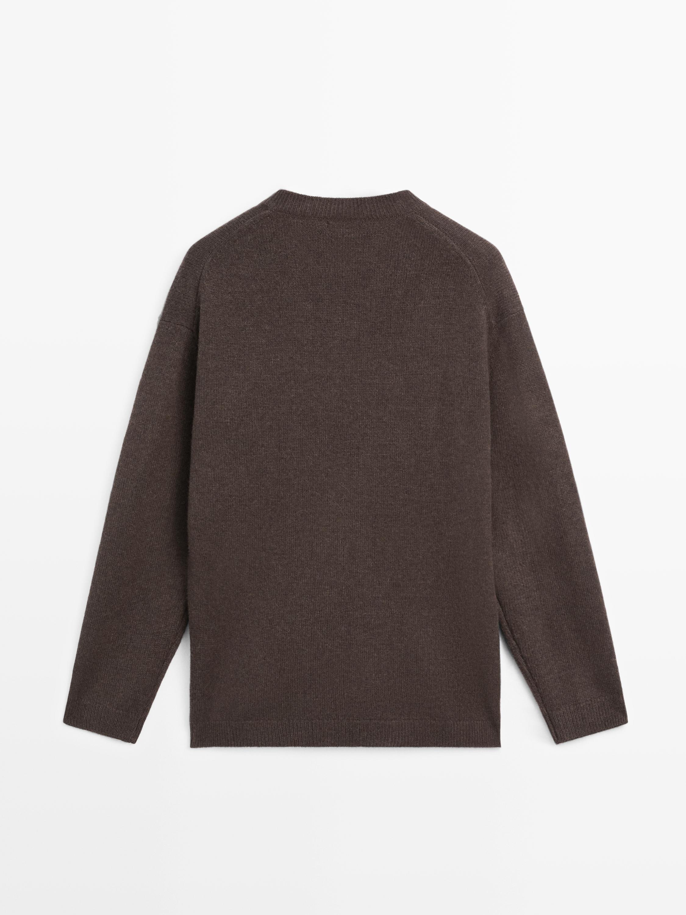 Camisola oversize de malha com decote em bico