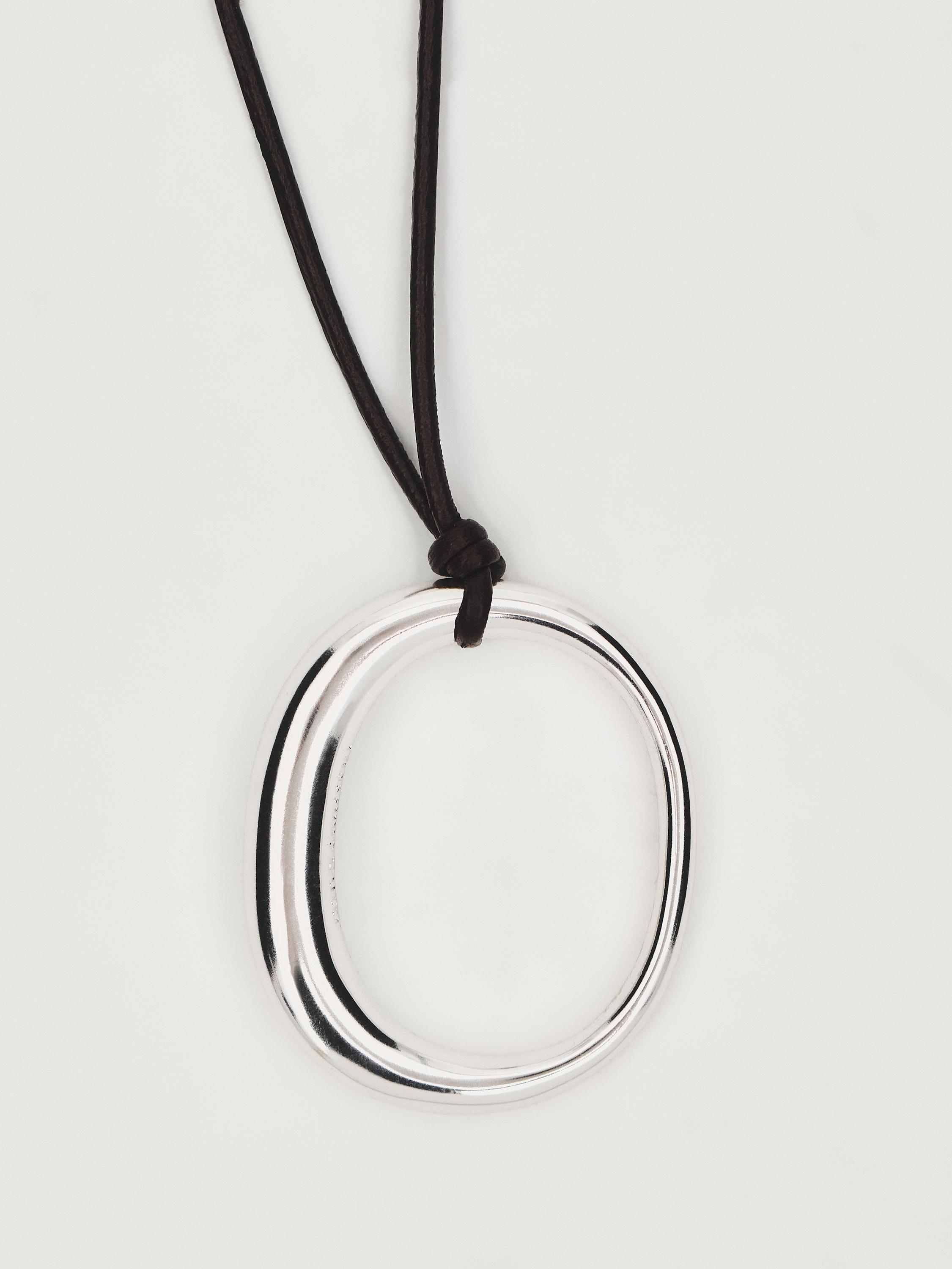 Leather cord necklace with oval piece