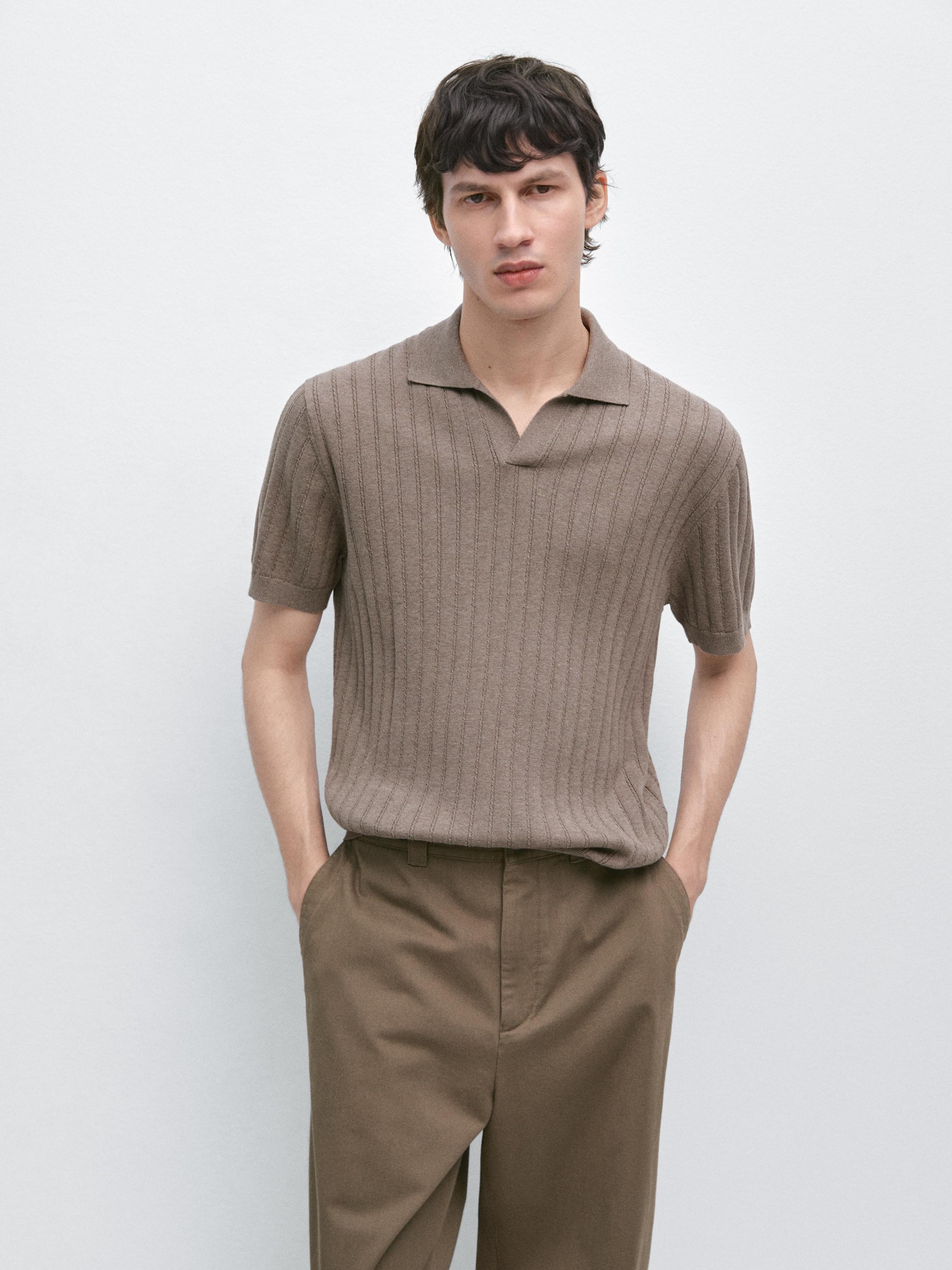 Mink cable knit open-collar polo sweater and brown pants with side pockets set.