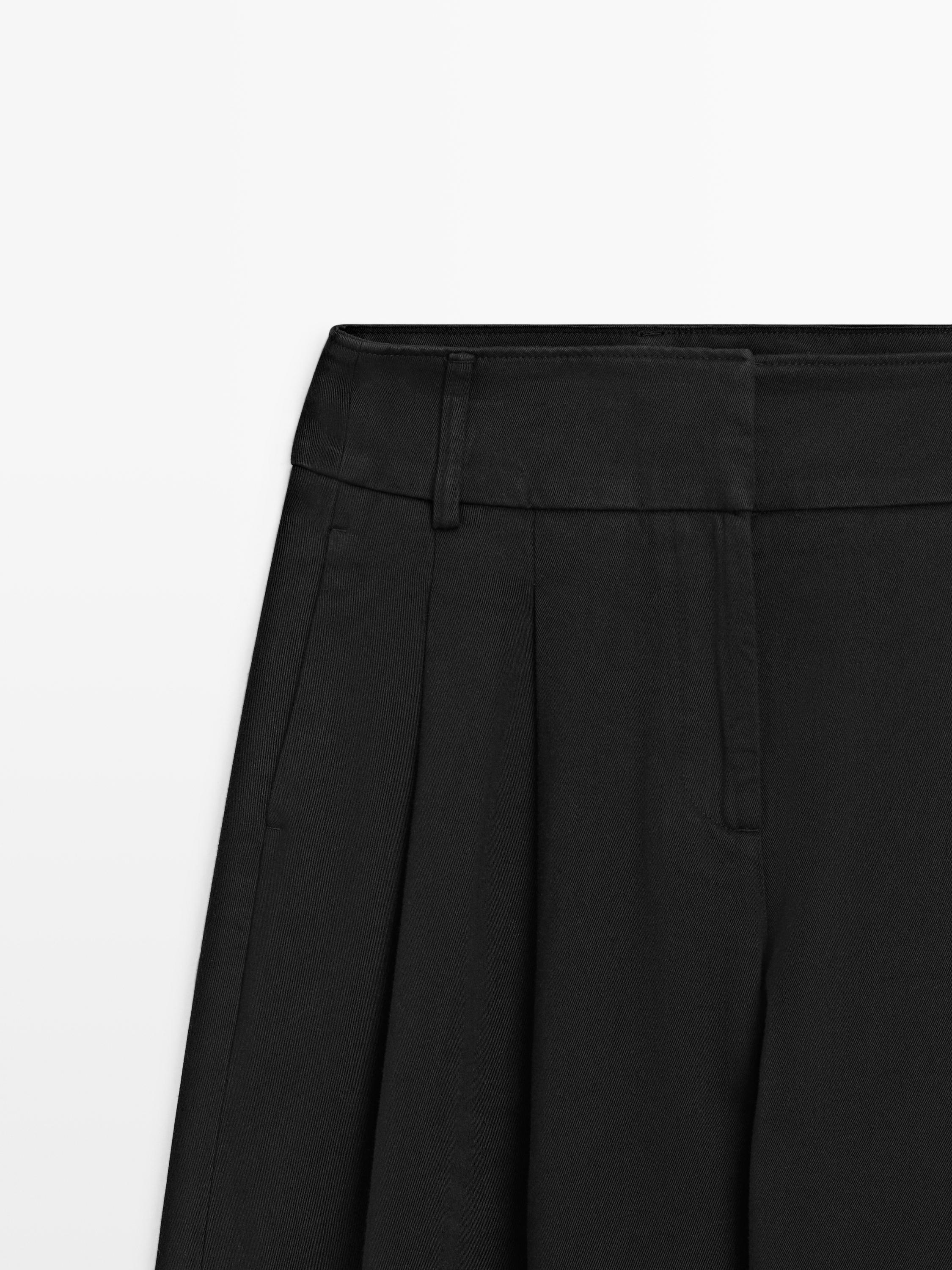 Pantaloni con pince wide leg