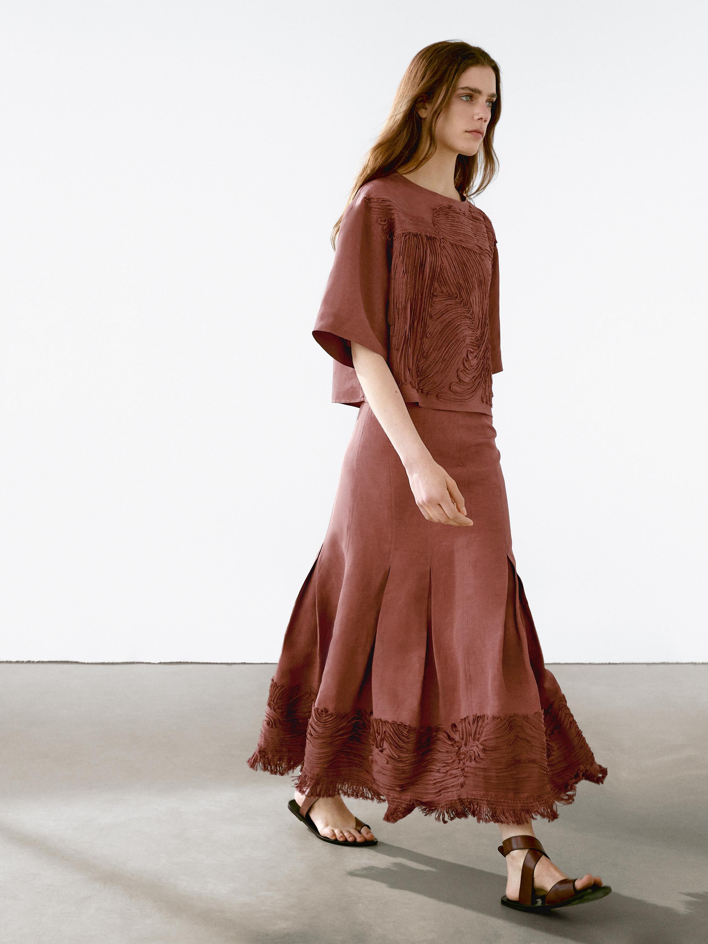 Flowing midi skirt with embroidered detail