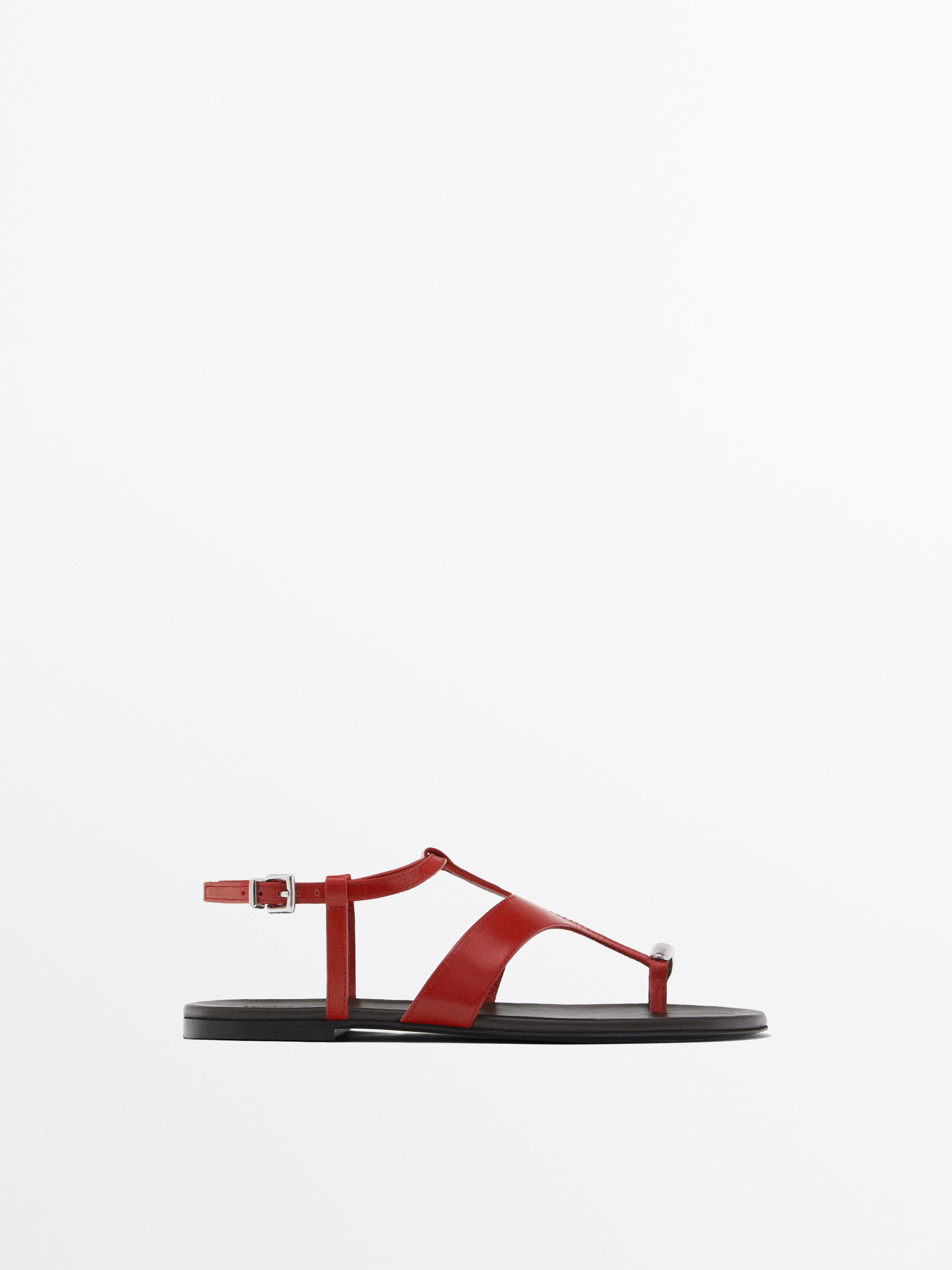 Flat sandals with metallic embellishment