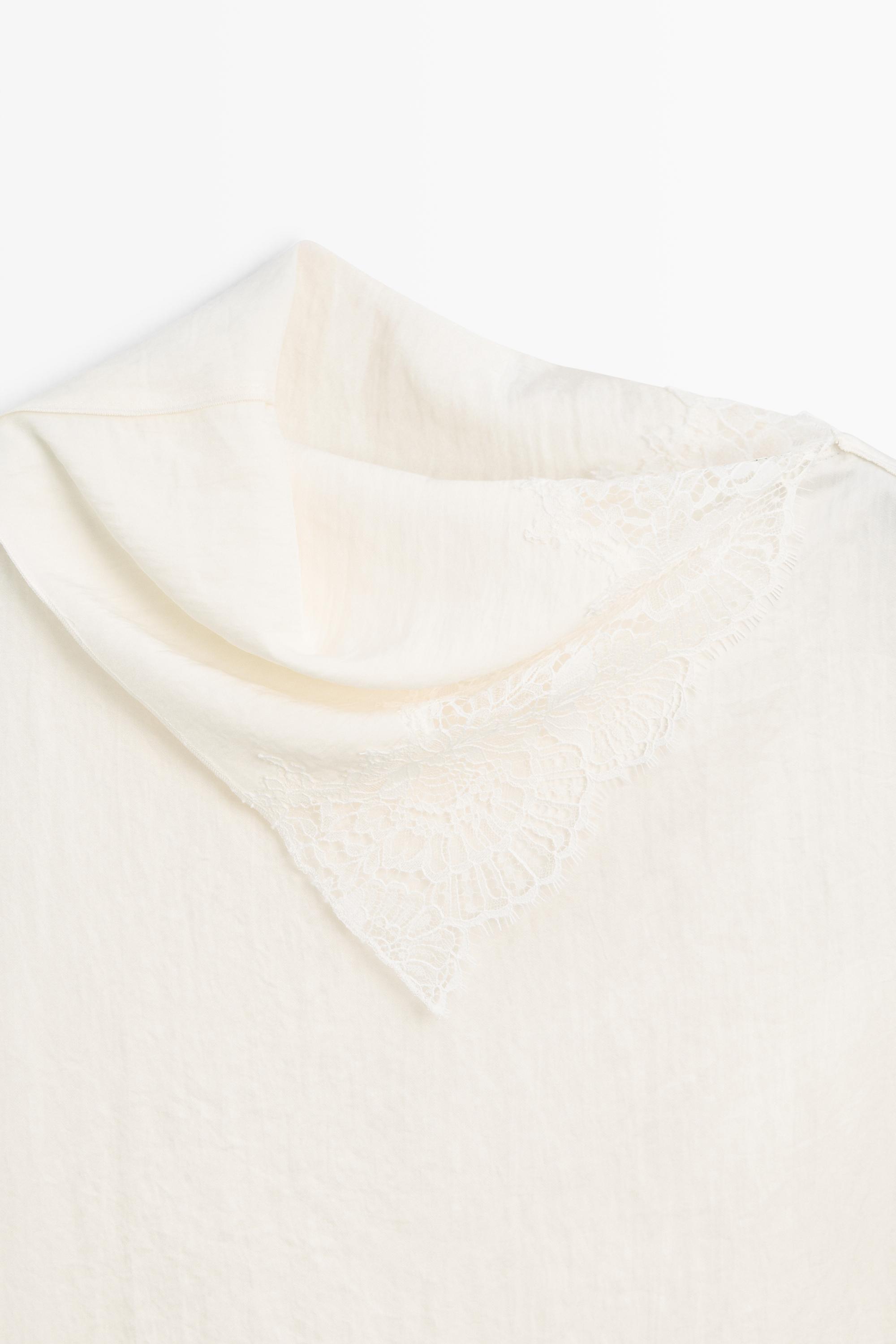 Asymmetric roll neck top with lace detail — CREAM