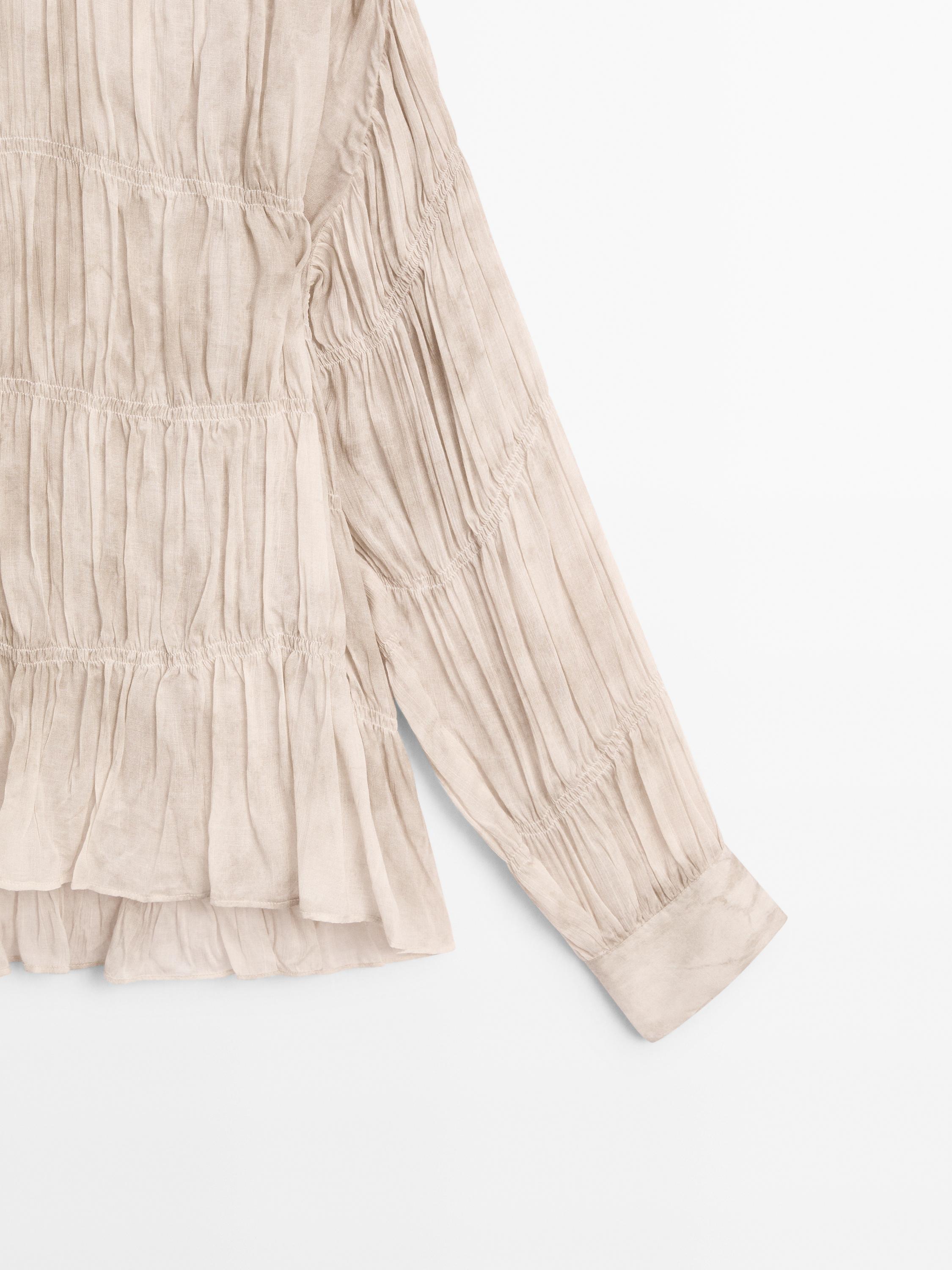 Flowing shirt with gathered details