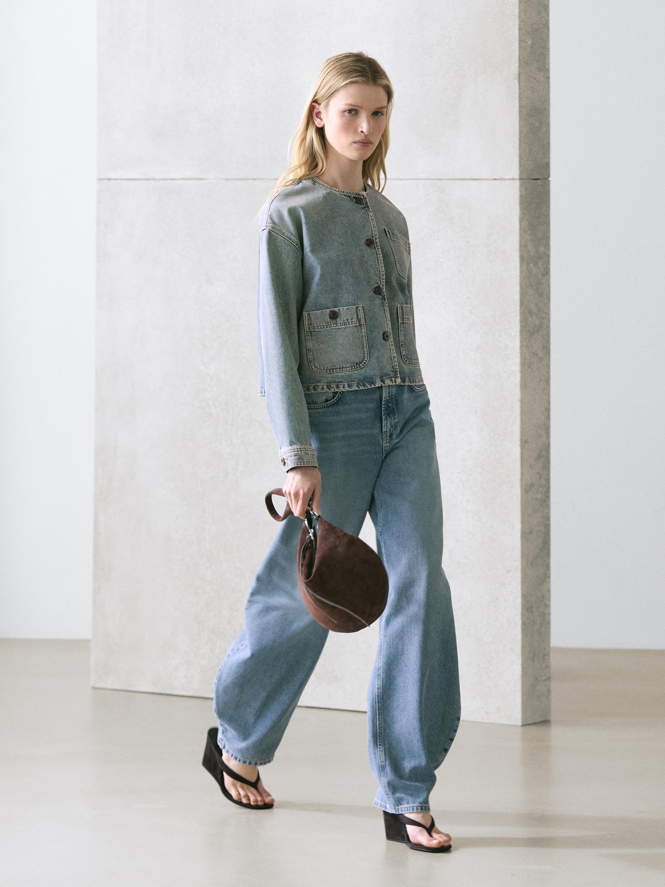 Light blue denim jacket set with front pockets and buttons, wide-leg jeans, and black sandals.