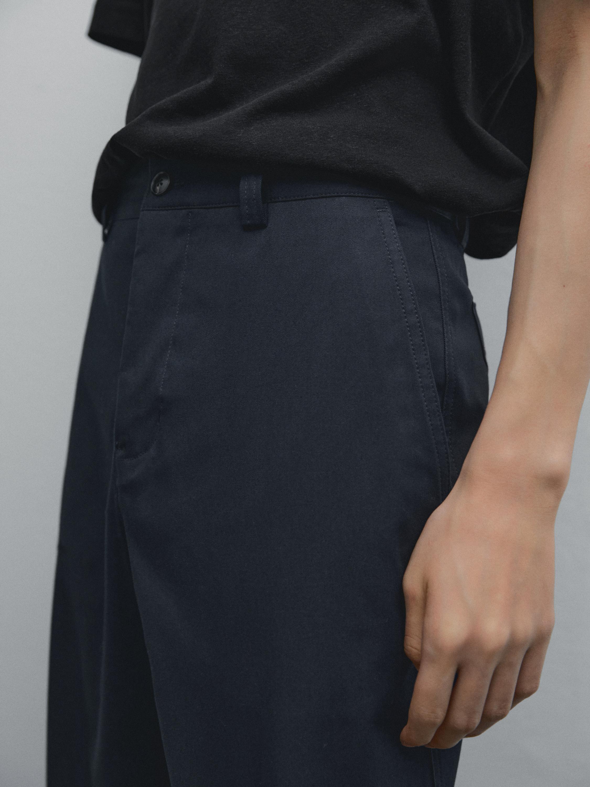 Slim fit cotton blend trousers.