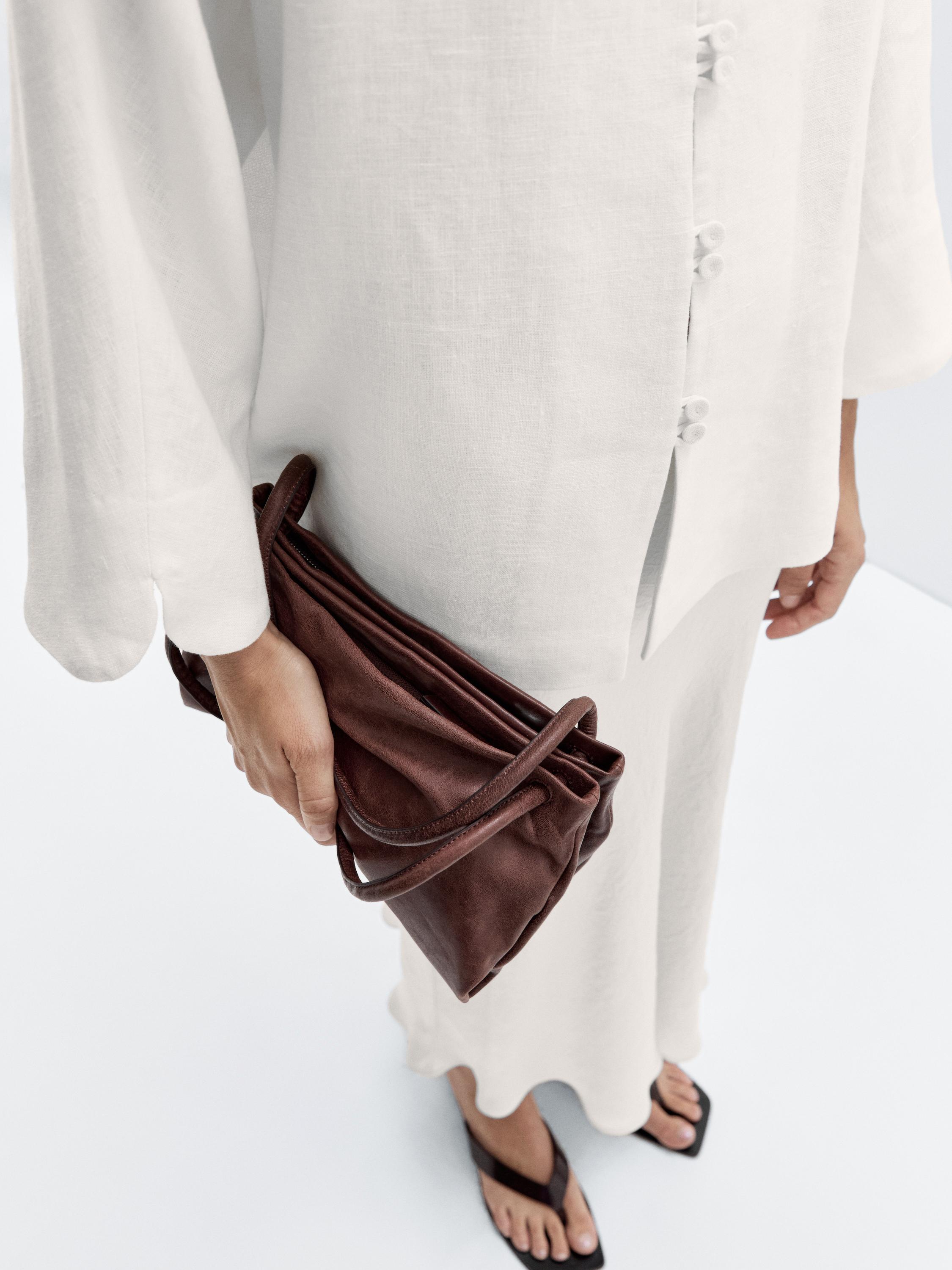 حقيبة صغيرة من جلد النابا بأقسام