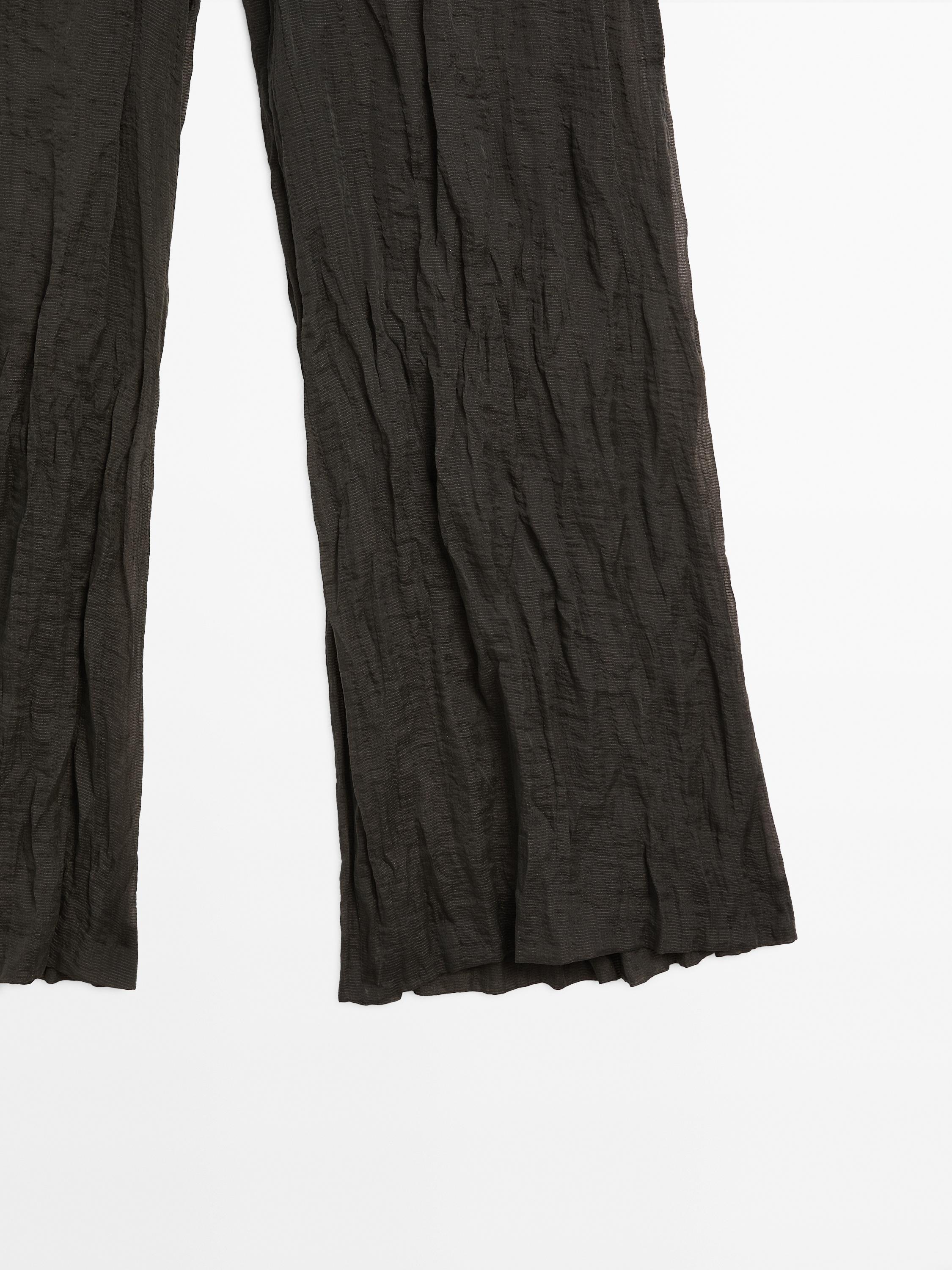 Creased-effect flowing trousers - Limited Edition
