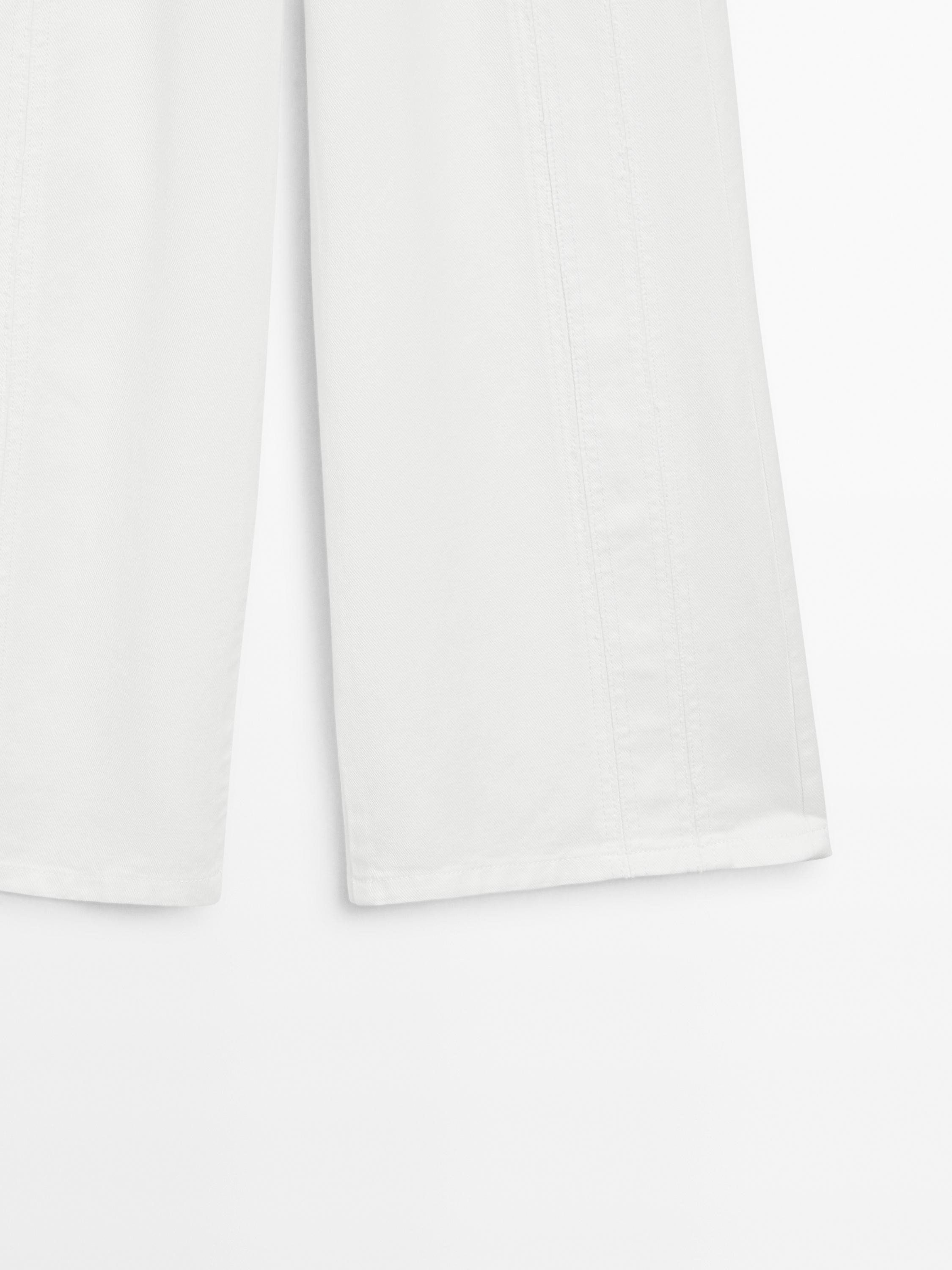 High-waist wide-leg jeans with seam details