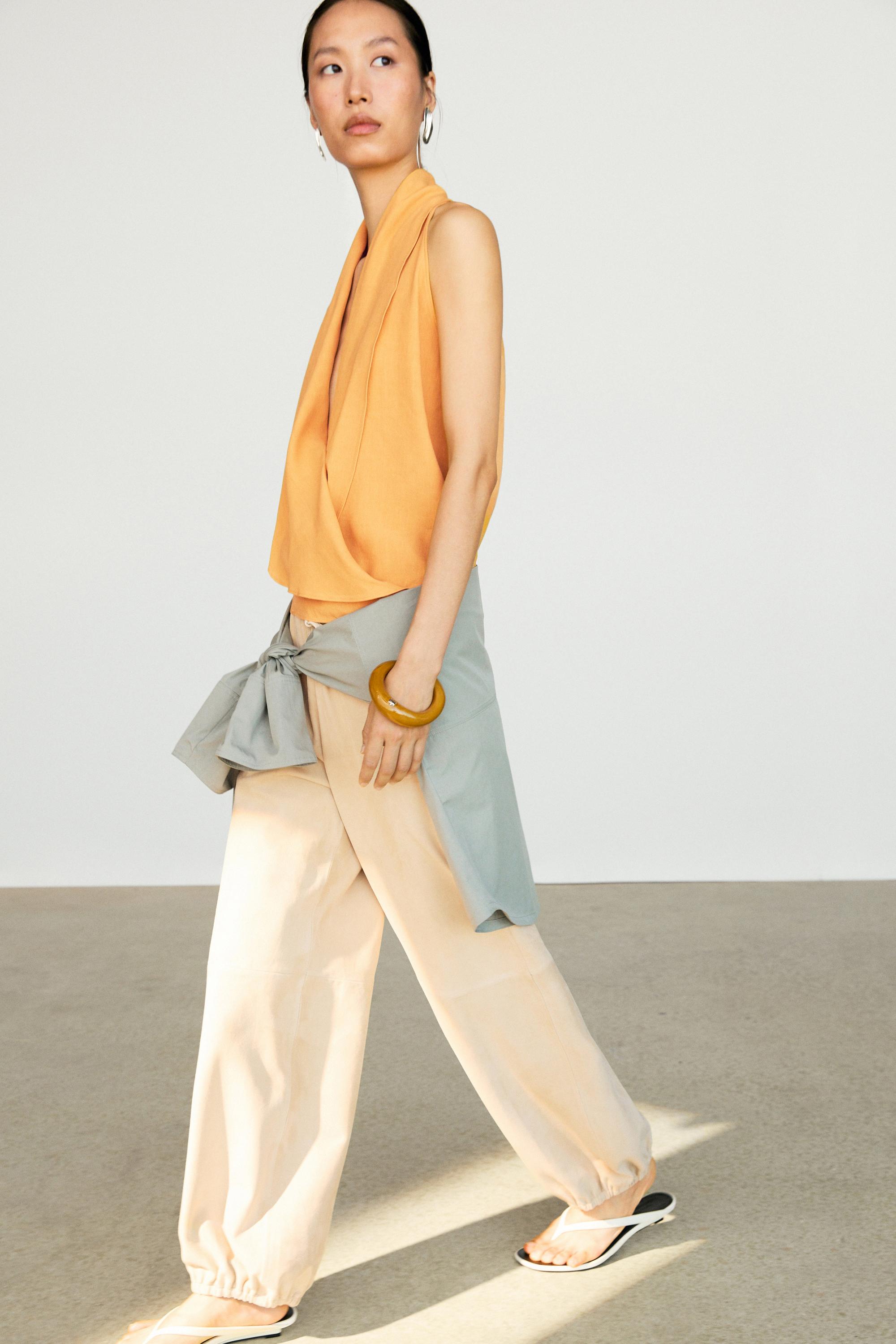 Flowing halter top with ruffle detail — YELLOW