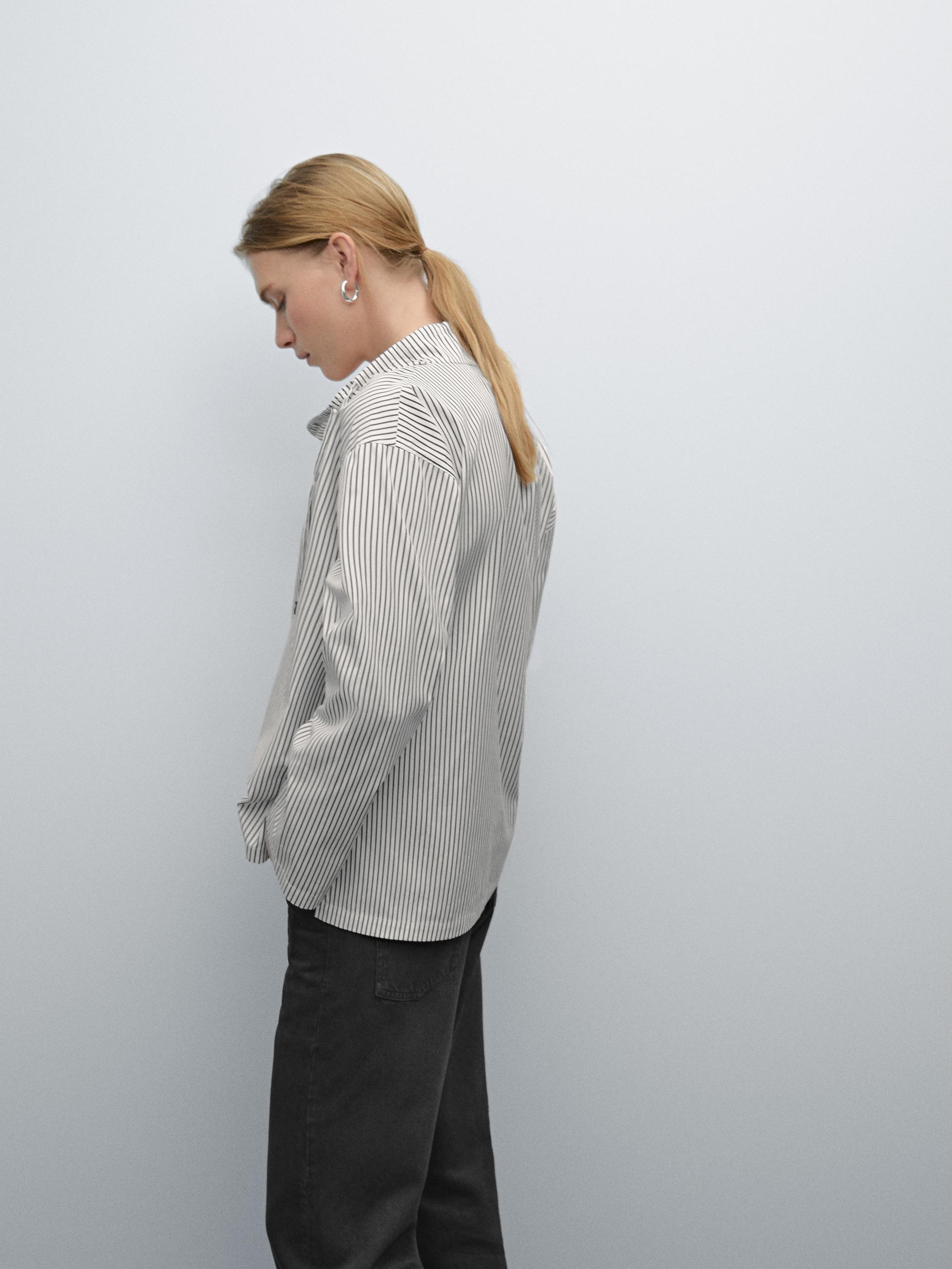 Blouse with neckline drawstring and appliqué