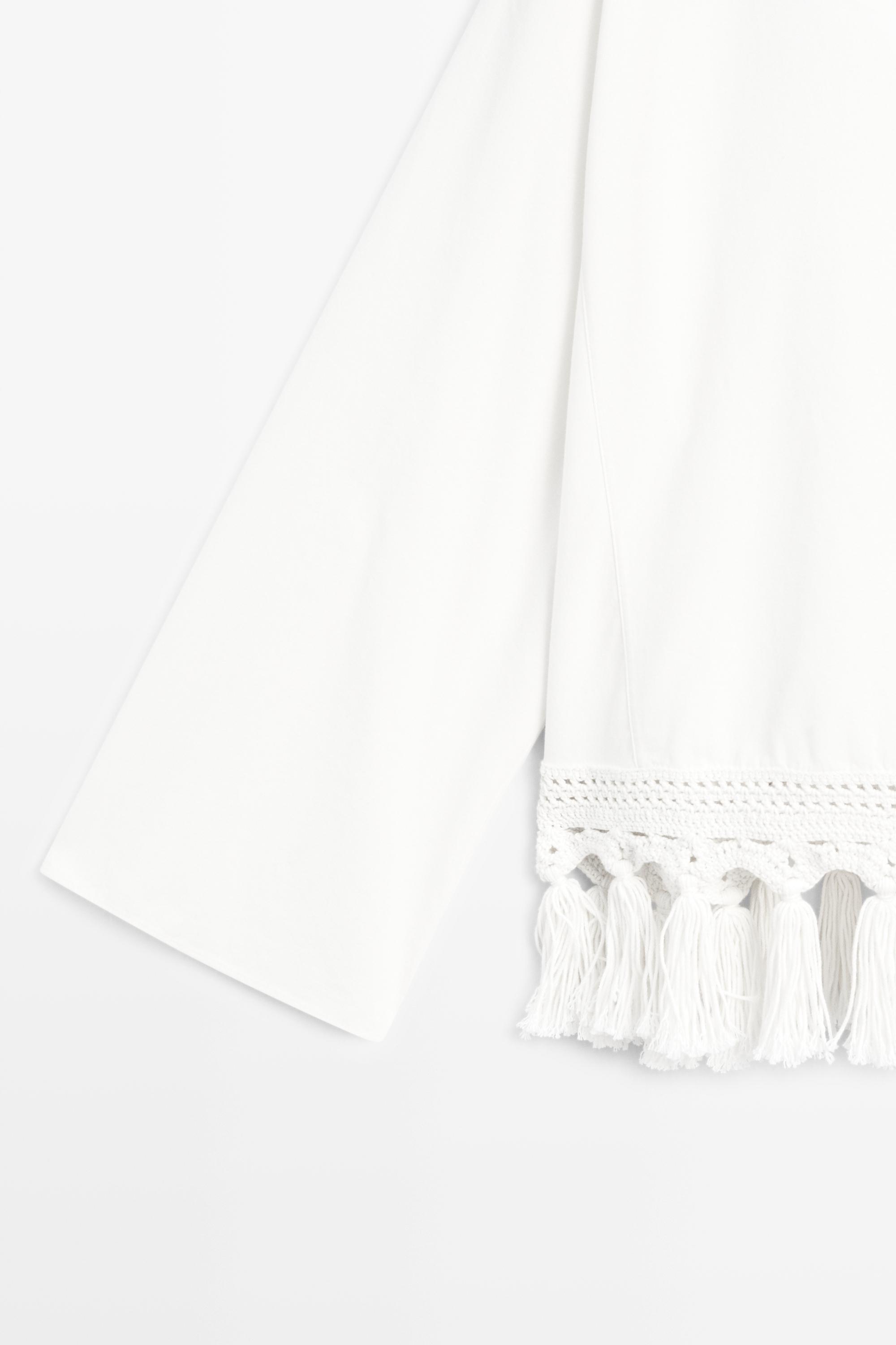 Embroidered blouse with fringed hem — WHITE