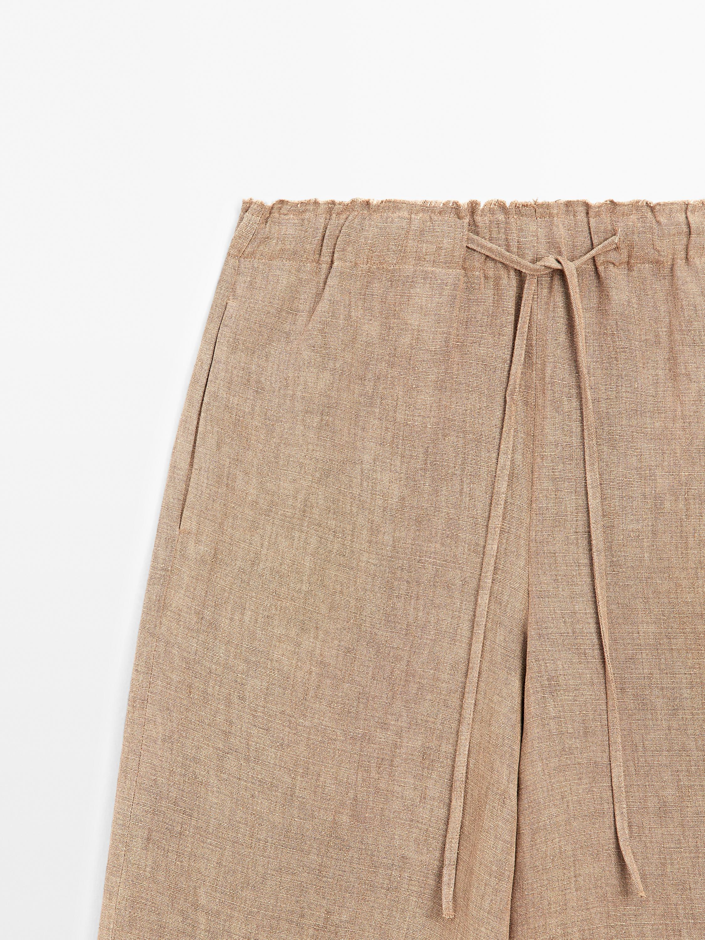 Linen suit trousers with frayed detail