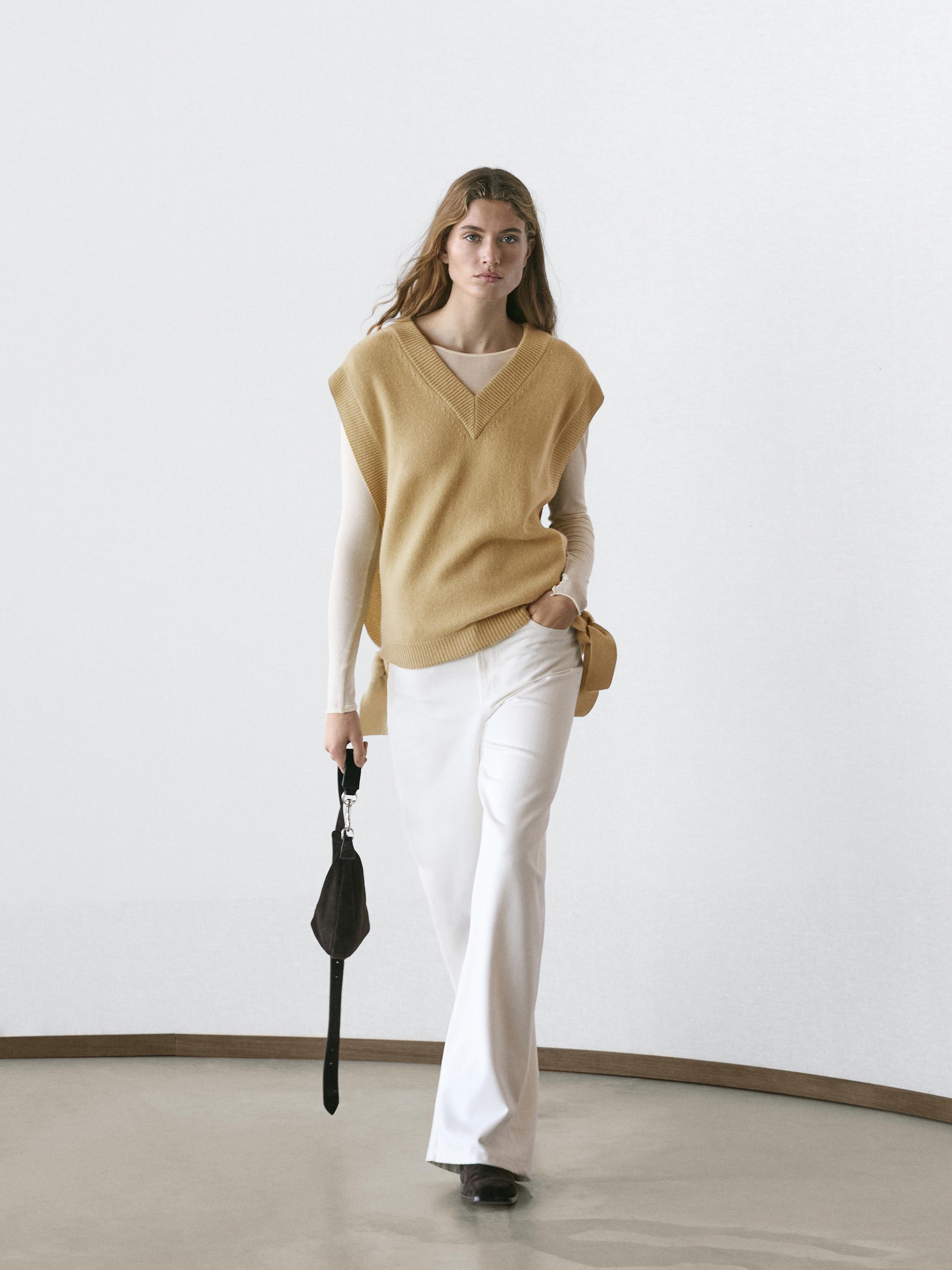 Mouwloze trui met V-hals en strikken