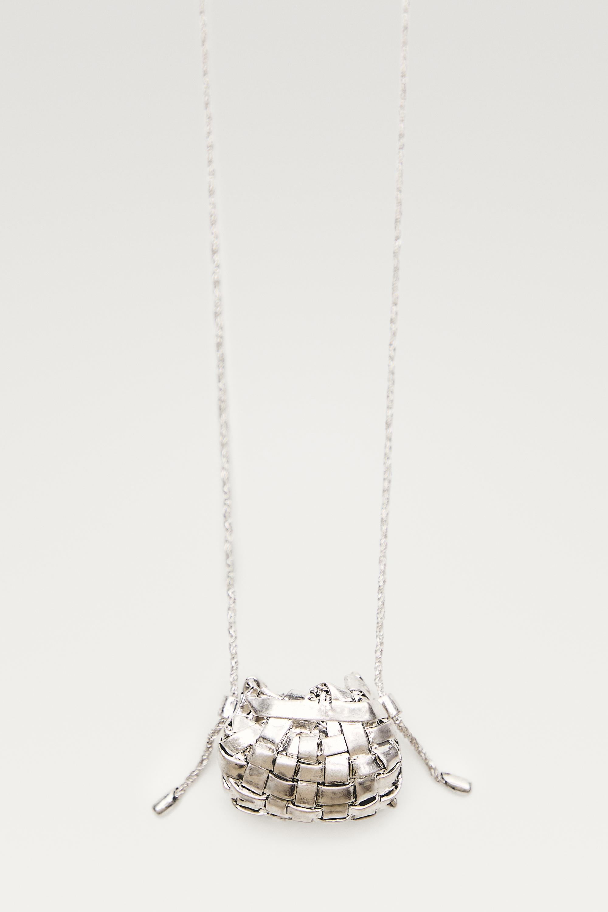 Long necklace with basket piece