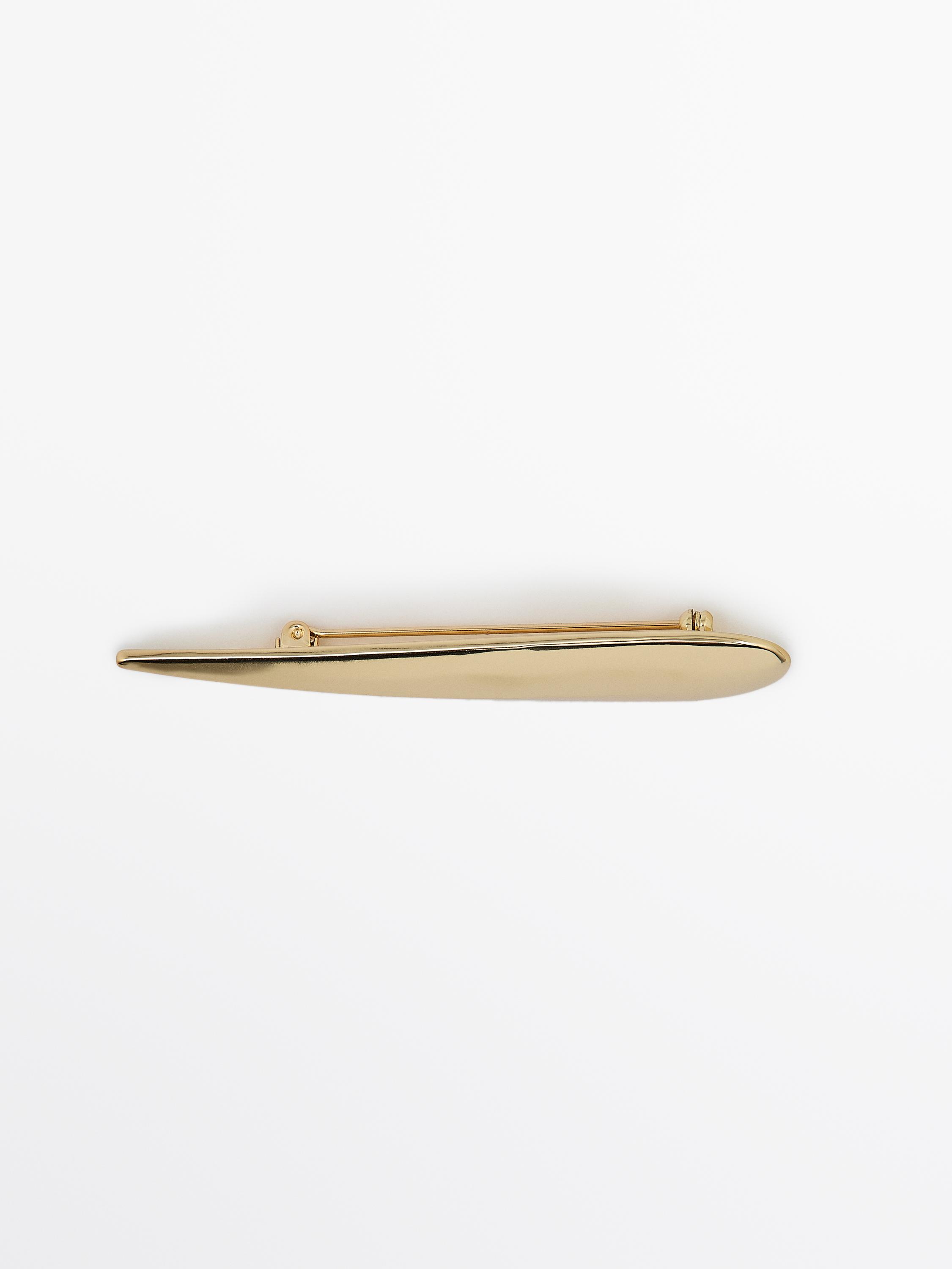 Golden teardrop brooch