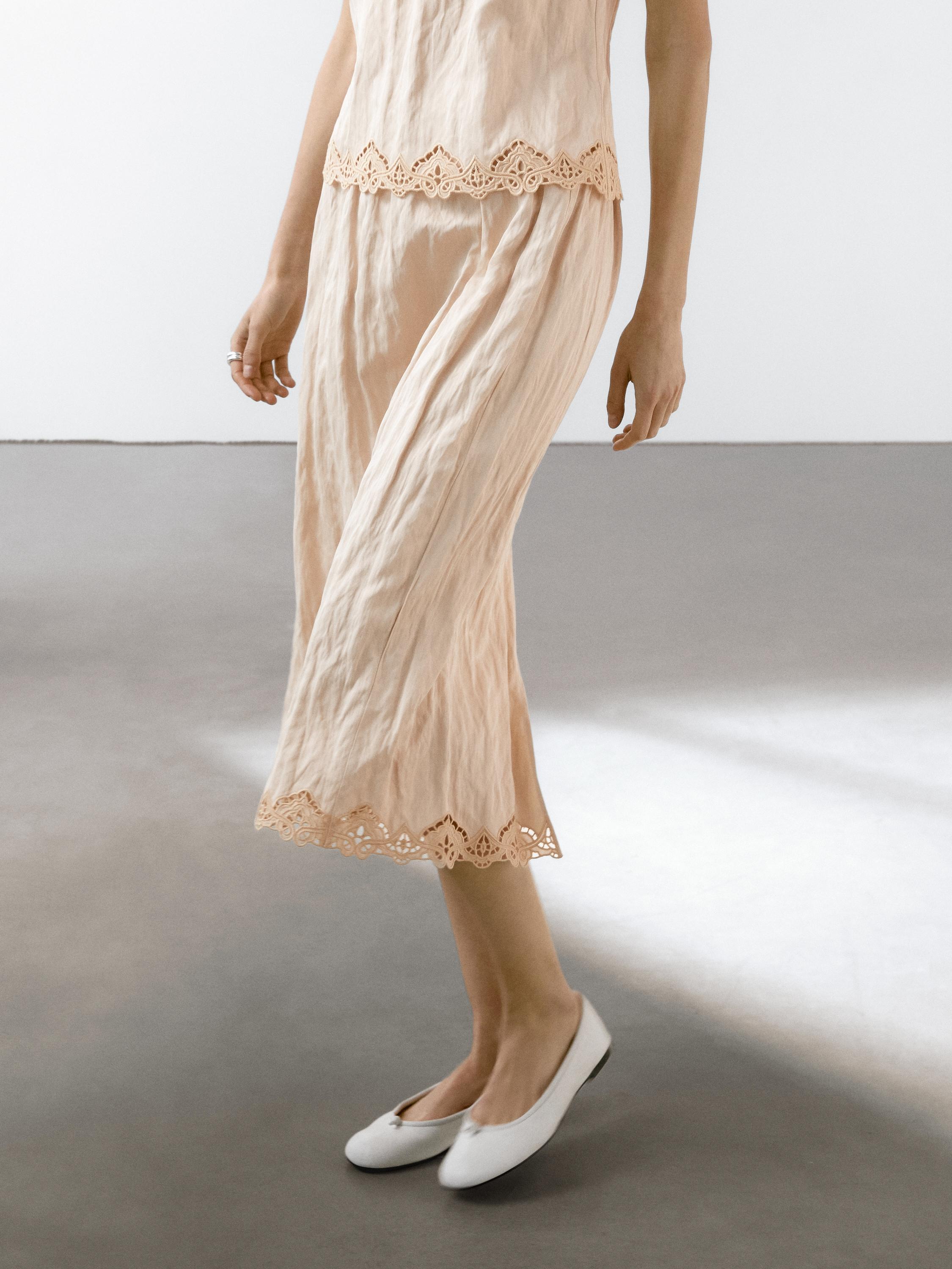Flowing midi skirt with blonde lace detail