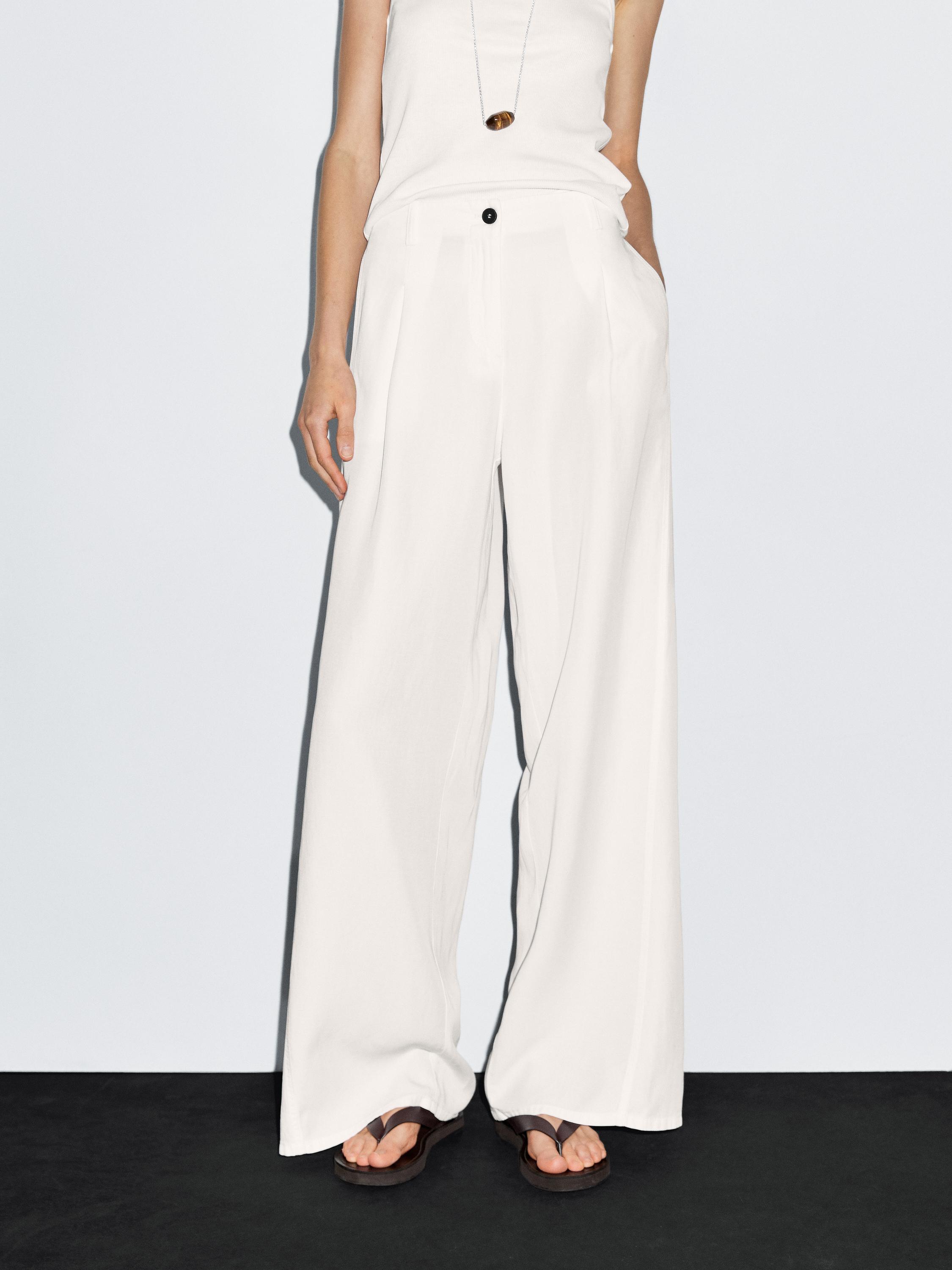 Flowing barrel fit trousers with seam detail