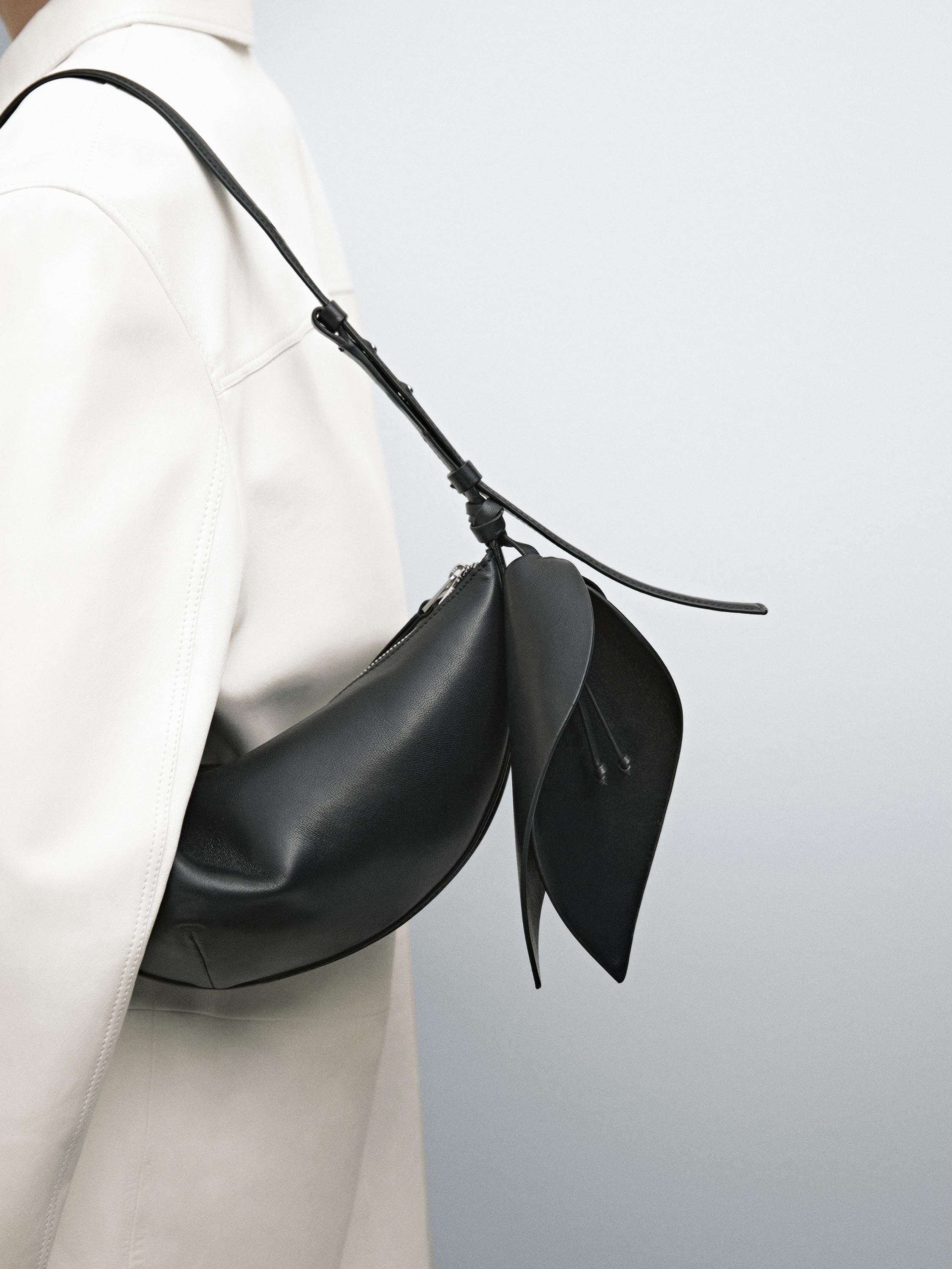 Nappa leather half-moon bag with flower detail