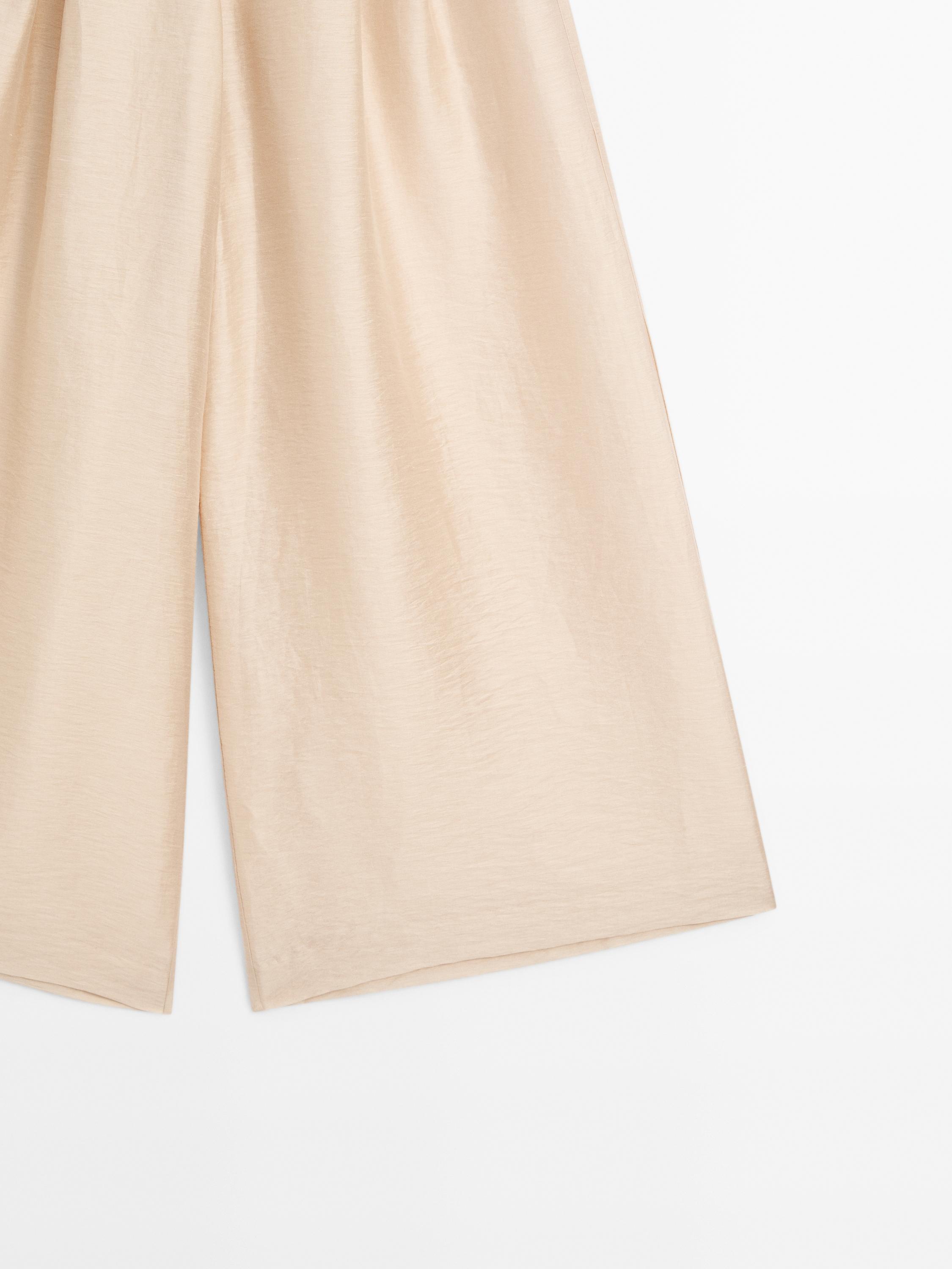 Splývavé nohavice z ľanovej zmesi so záševkami