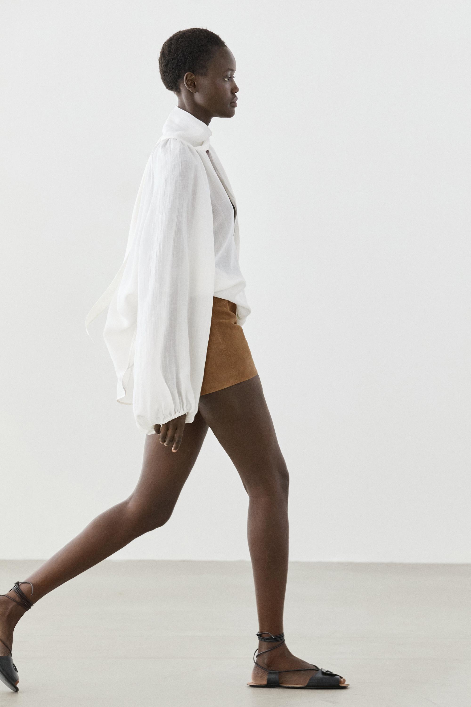Flowing V-neck blouse with tie — WHITE