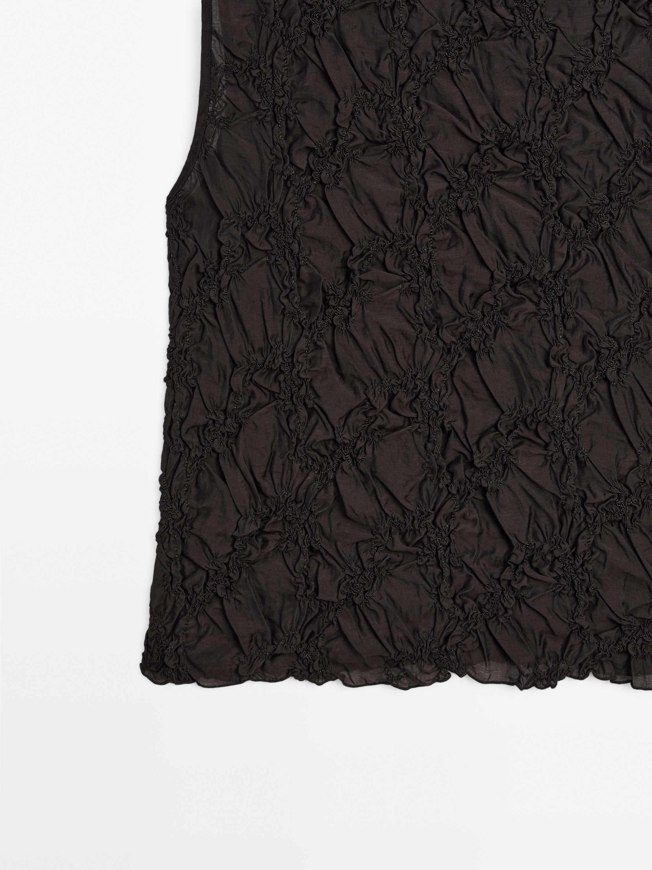 Creased-effect funnel neck top