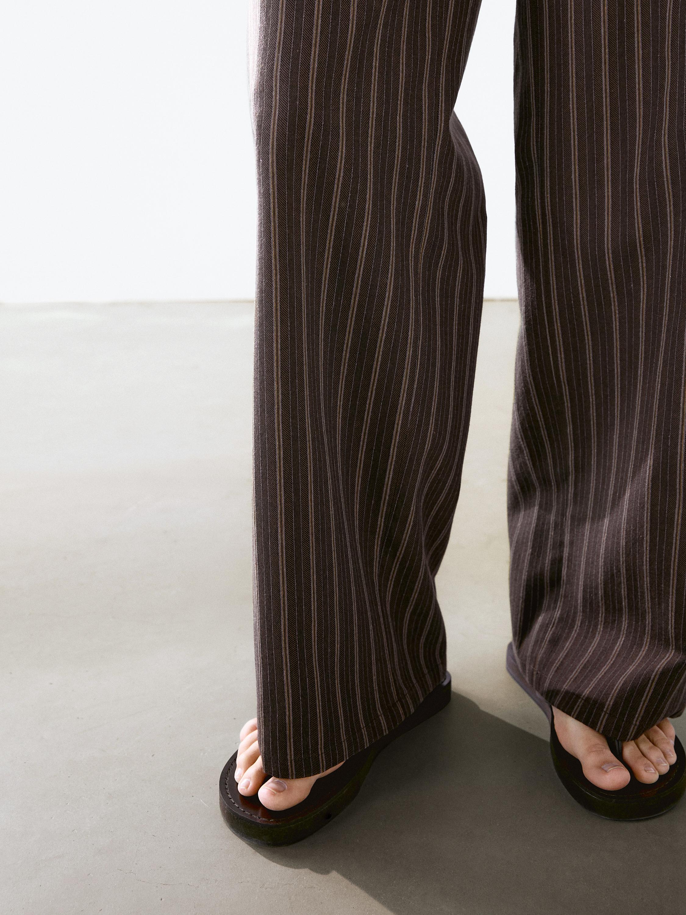 Low-rise wide-leg striped trousers