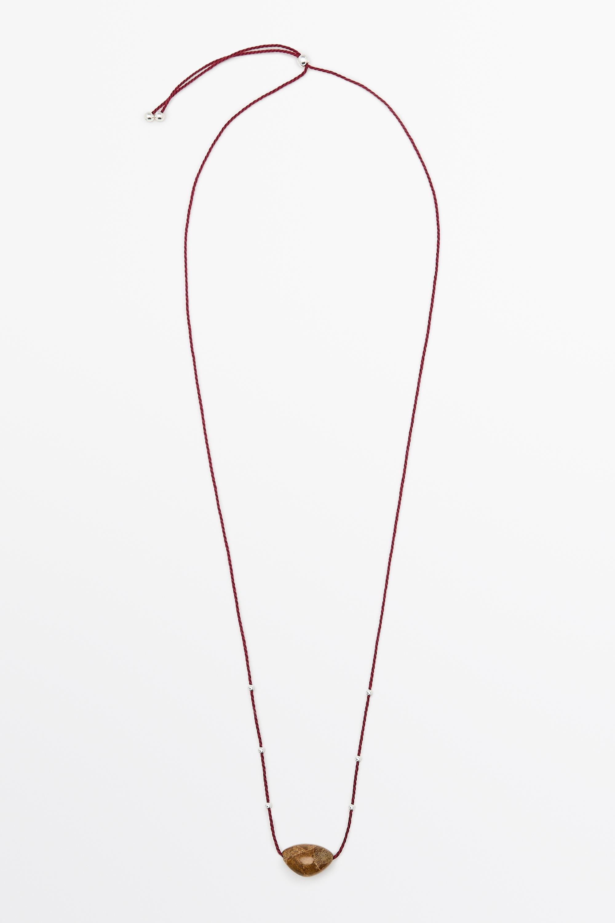 Collar gema irregular