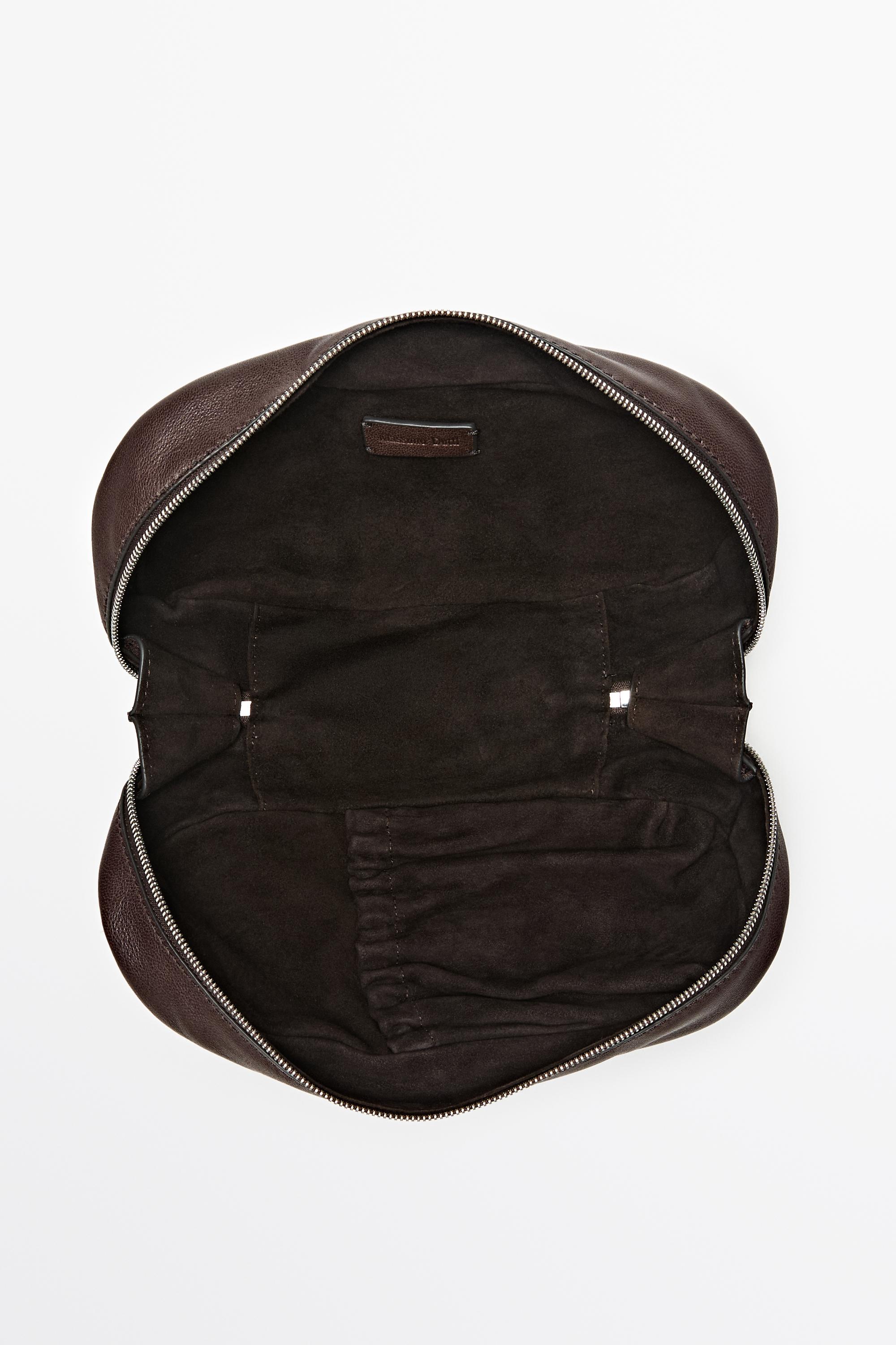 Oval nappa leather toiletry bag — BROWN