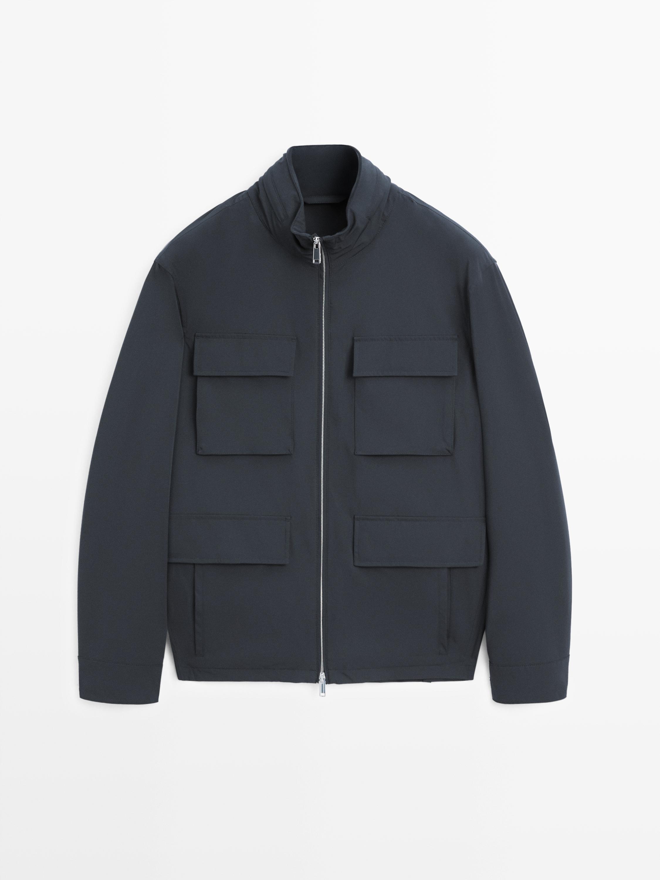 Front view of navy blue jacket with front zipper and four flap pockets.