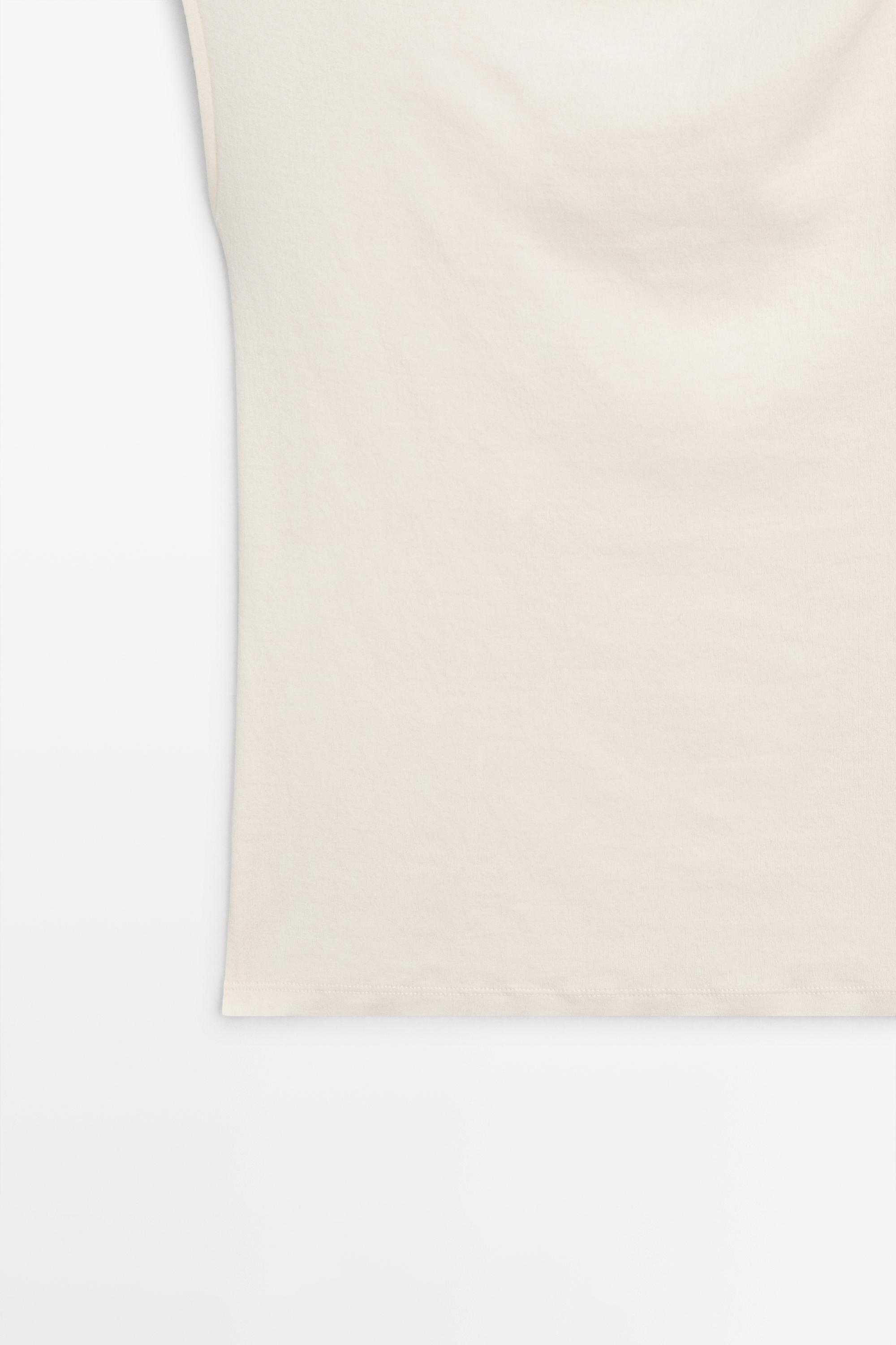 Parlak taş detaylı asimetrik bluz