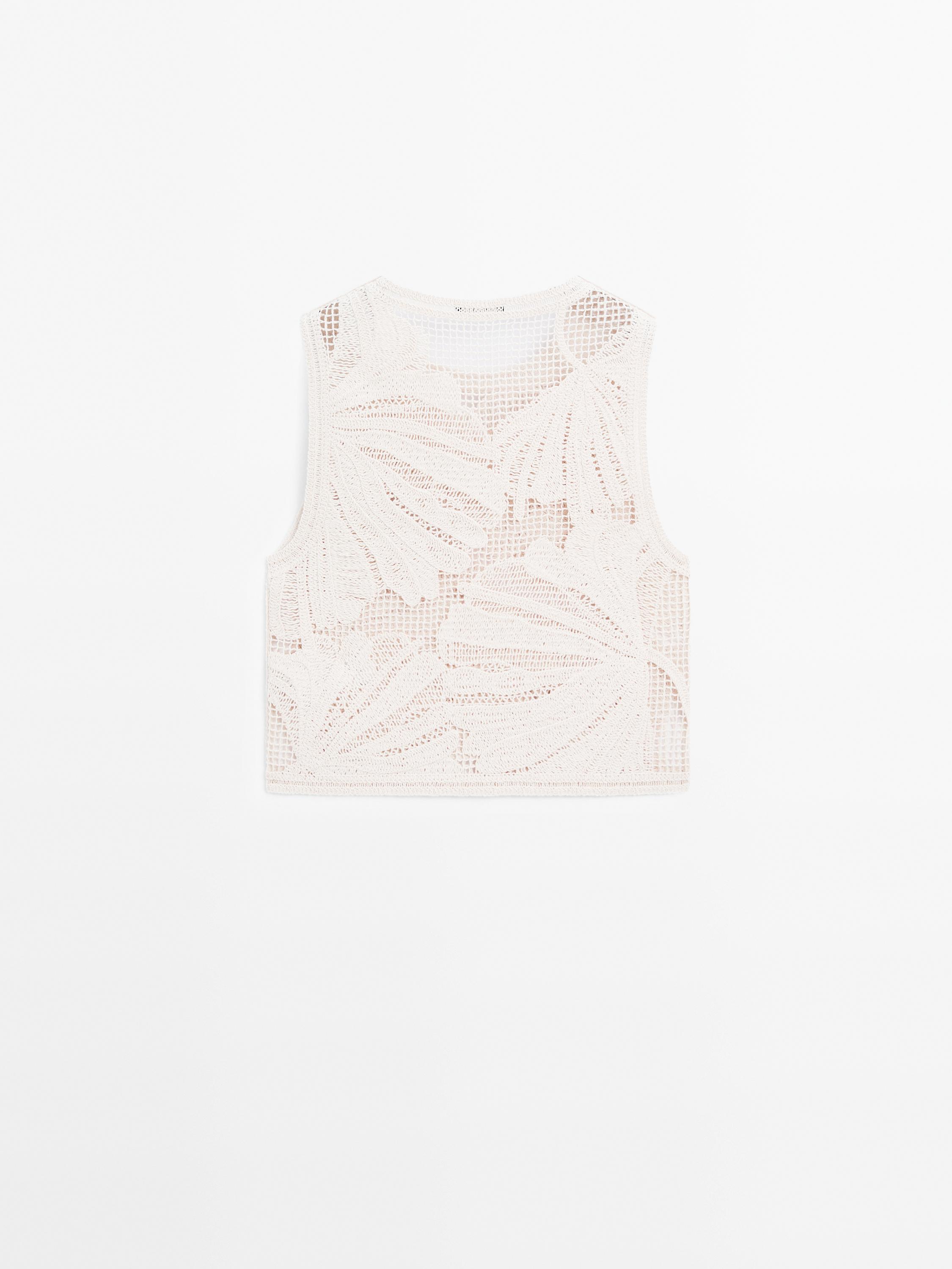 Openwork crochet top with floral detail