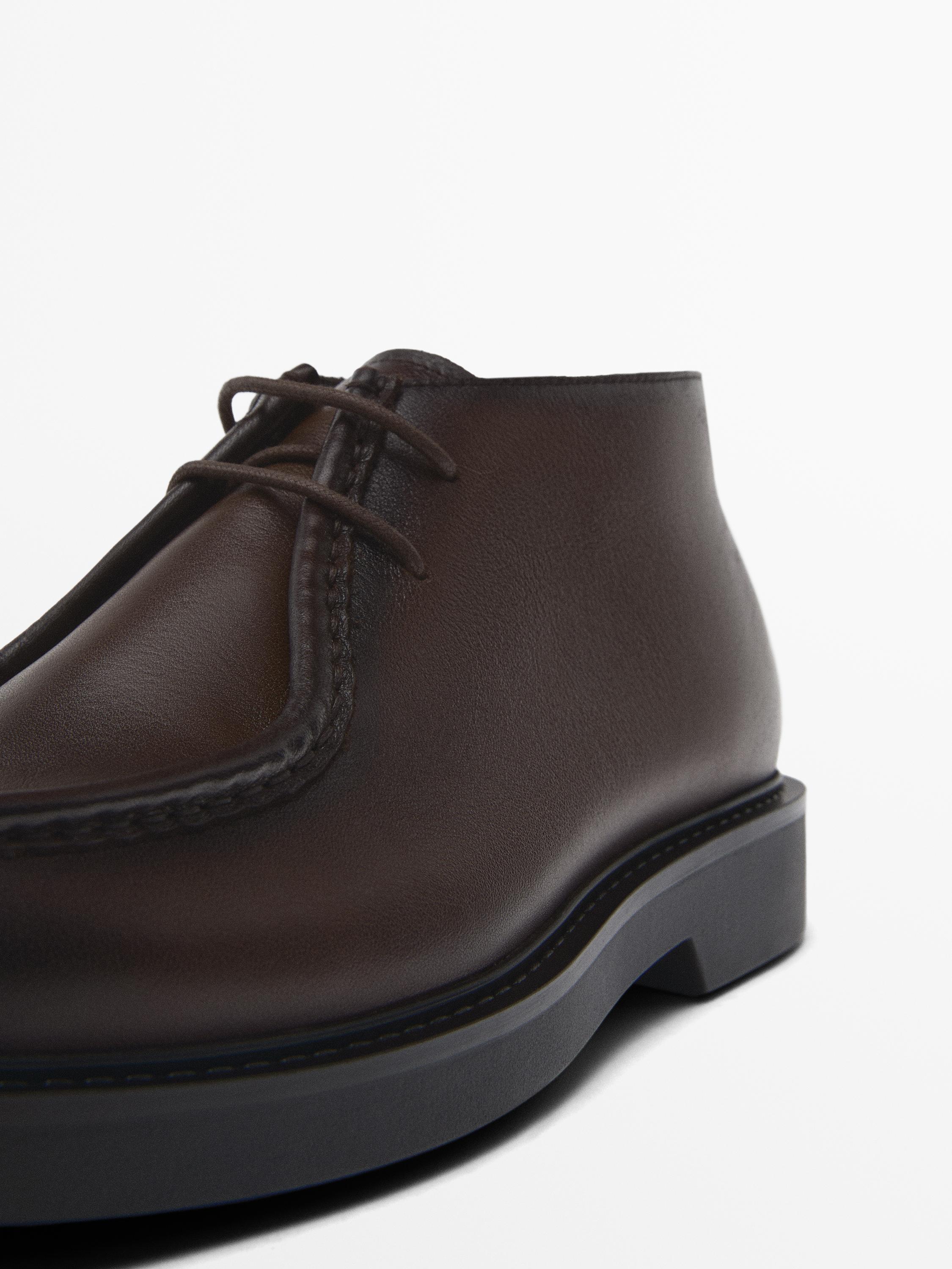 Bottines avec ganse en cuir