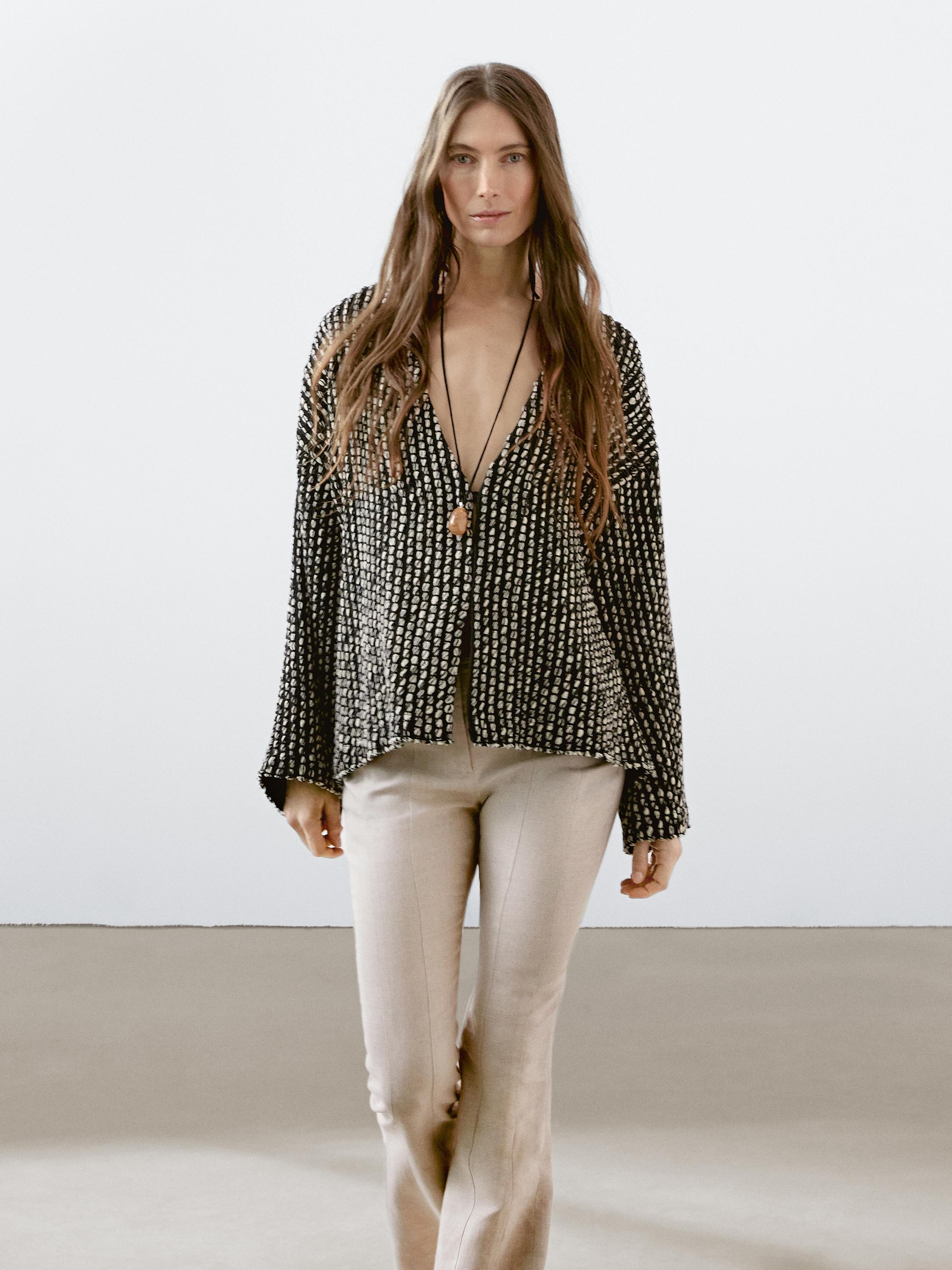 Flared trousers with contrast waist