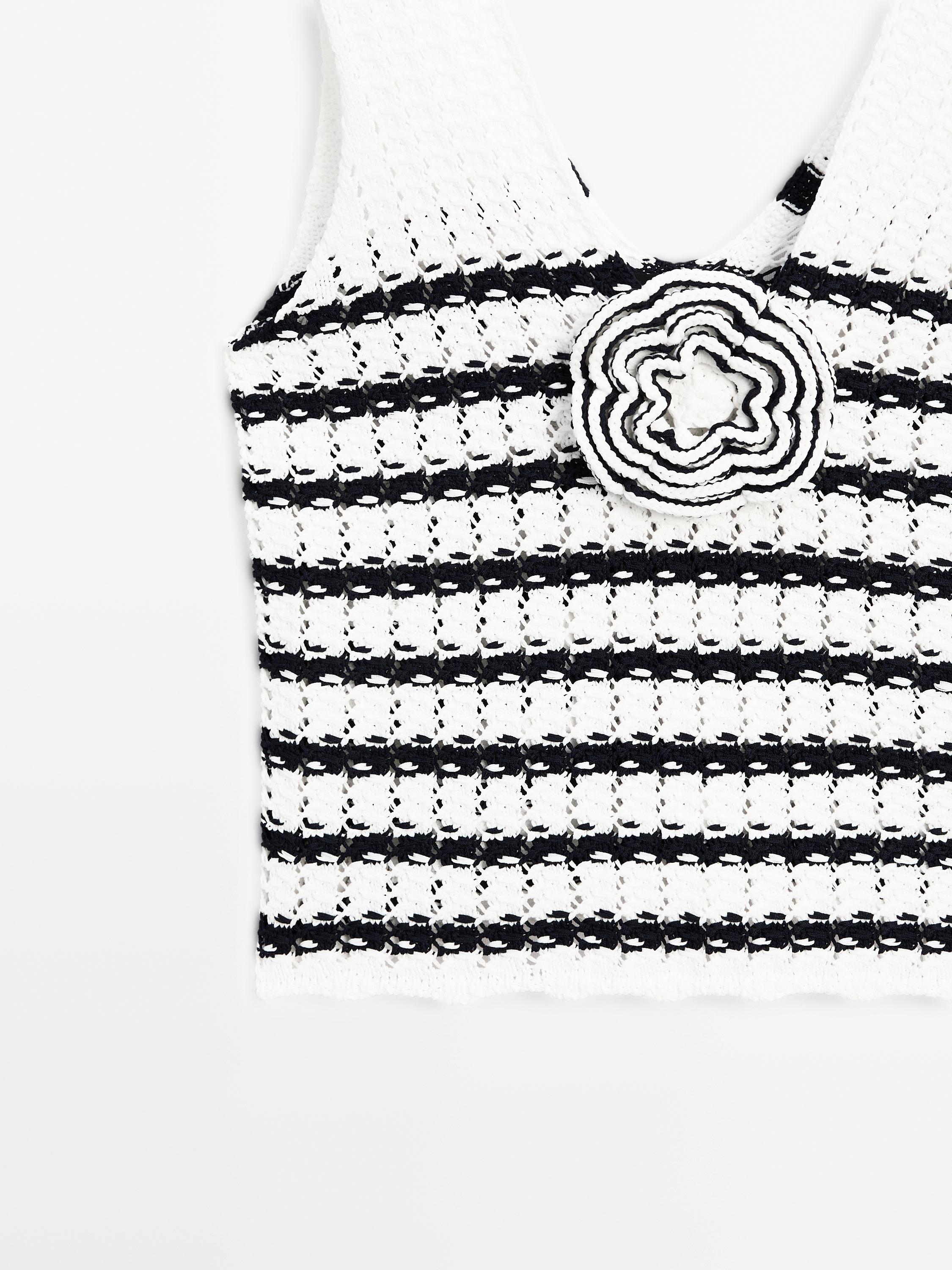 Knit top with floral detail