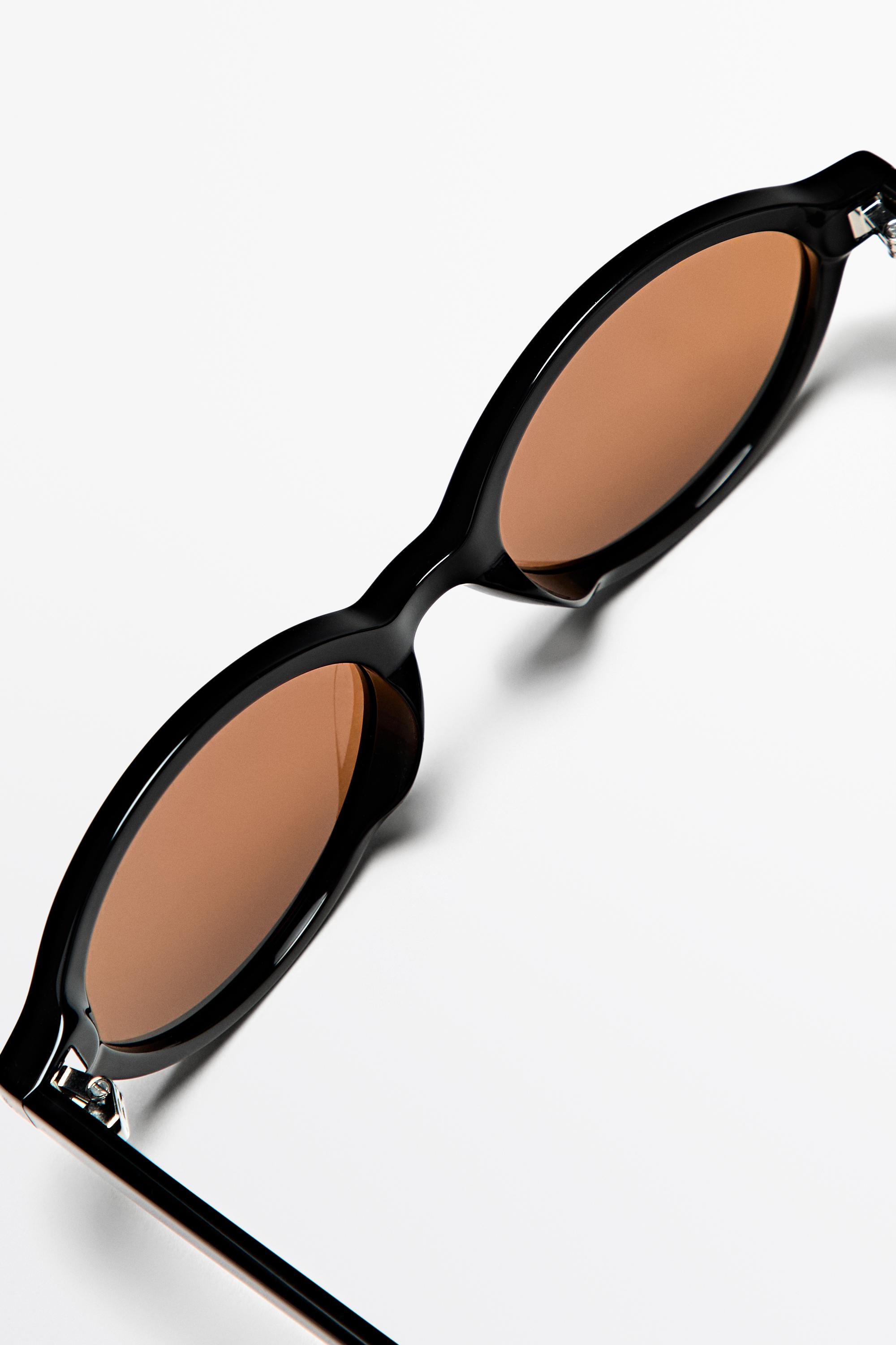 Oval sunglasses — BLACK