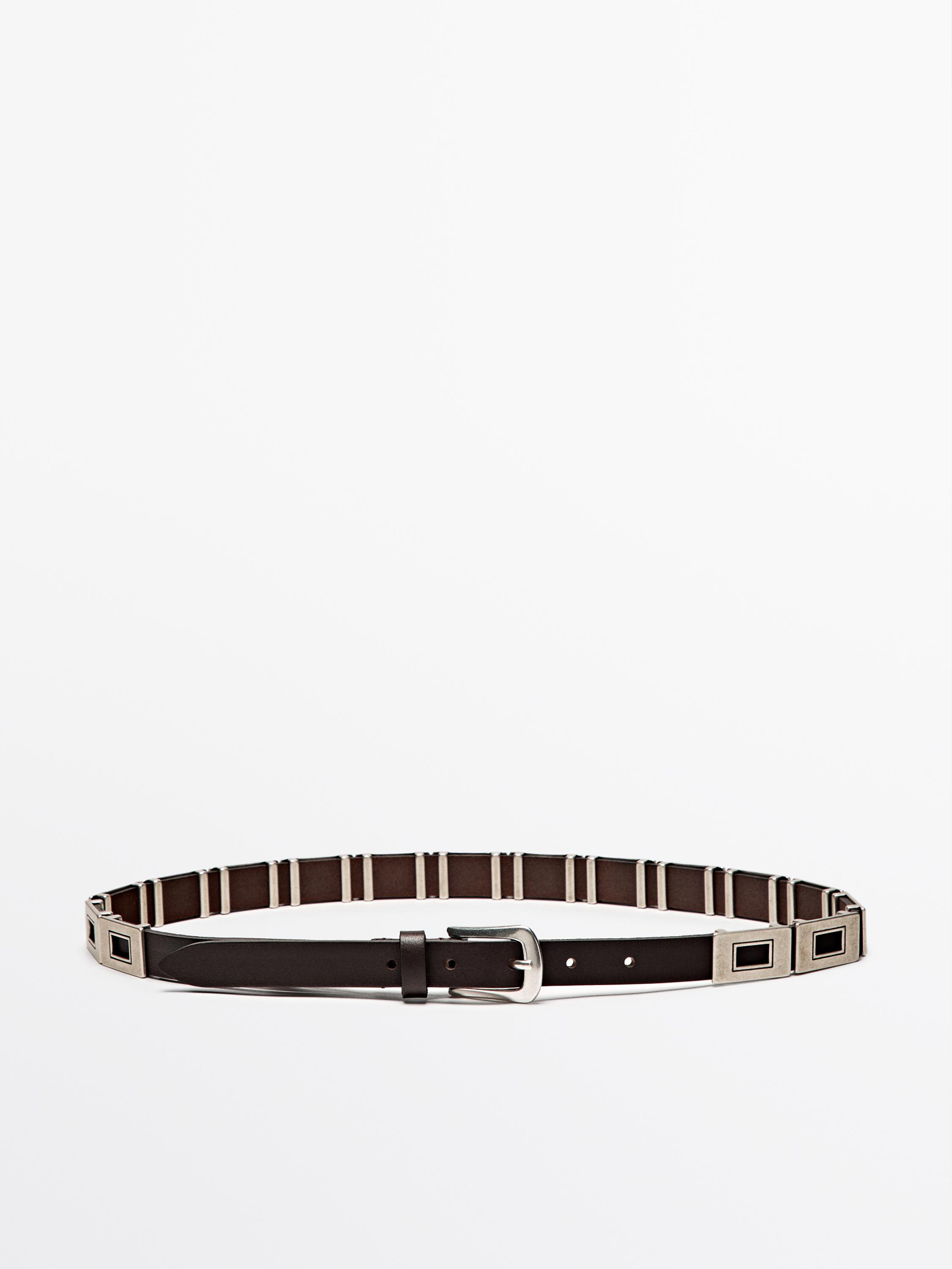 Belt with metal appliqués
