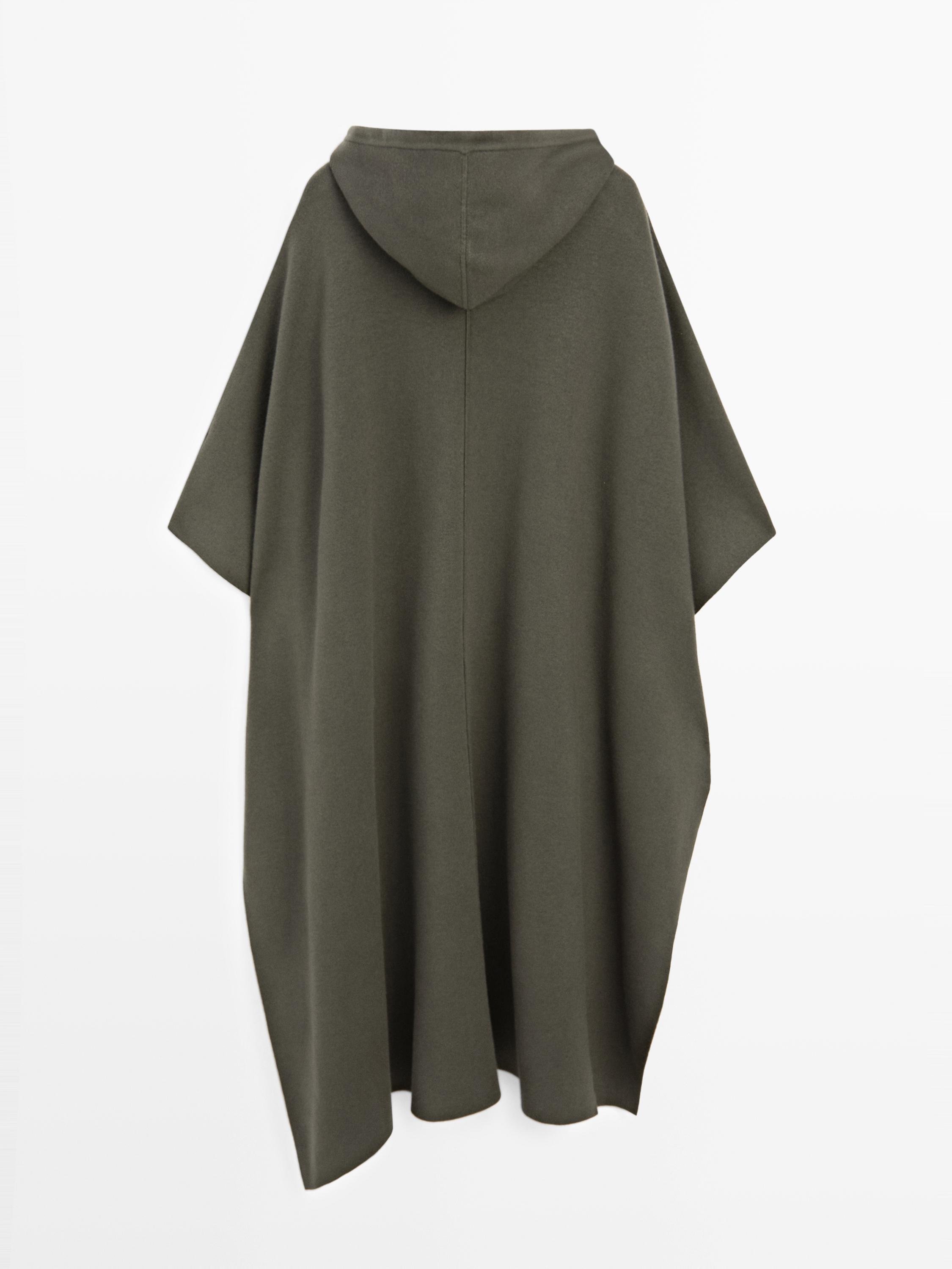 Long knit cape with adjustable hood