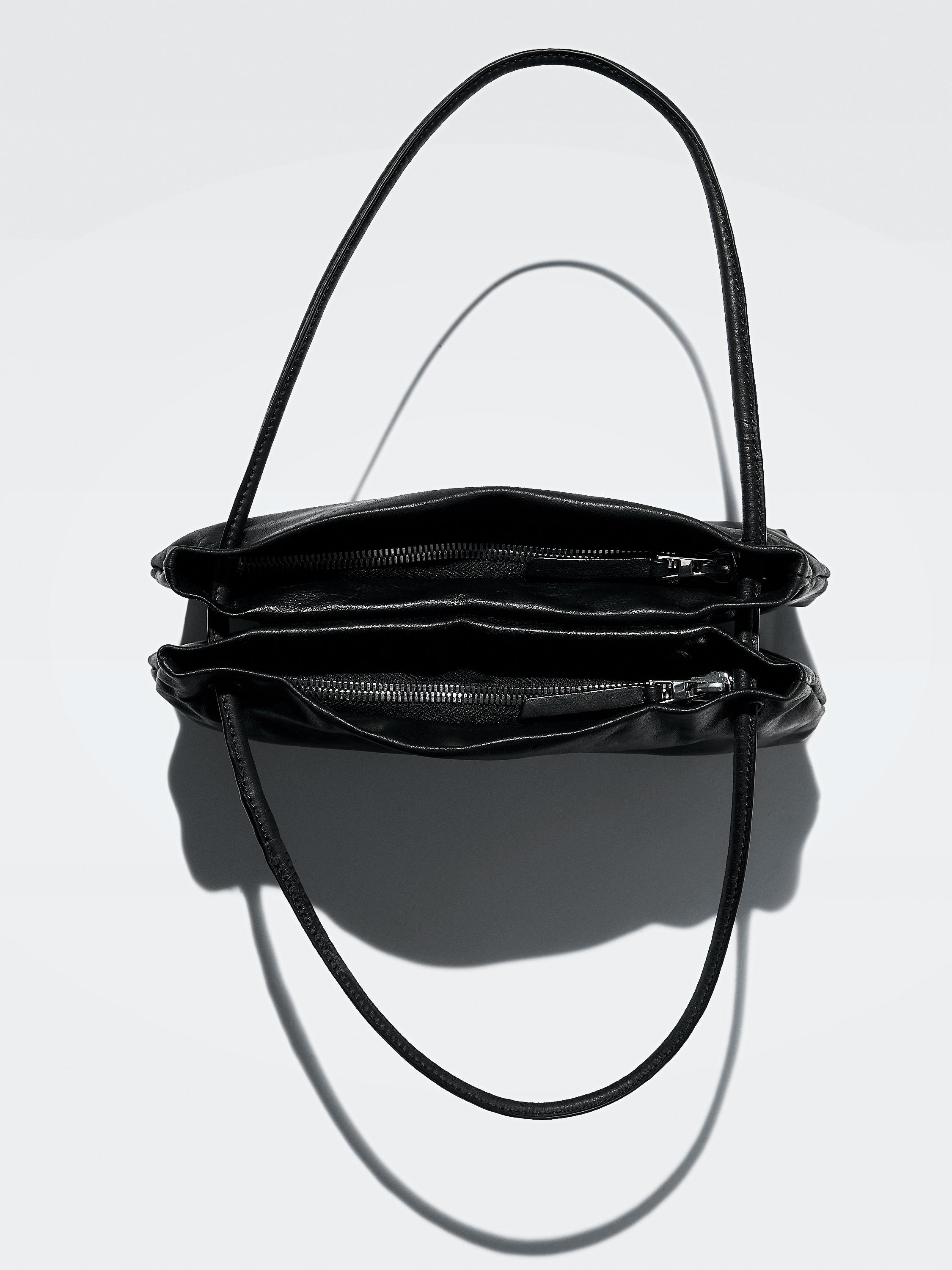Small nappa leather bag with compartments