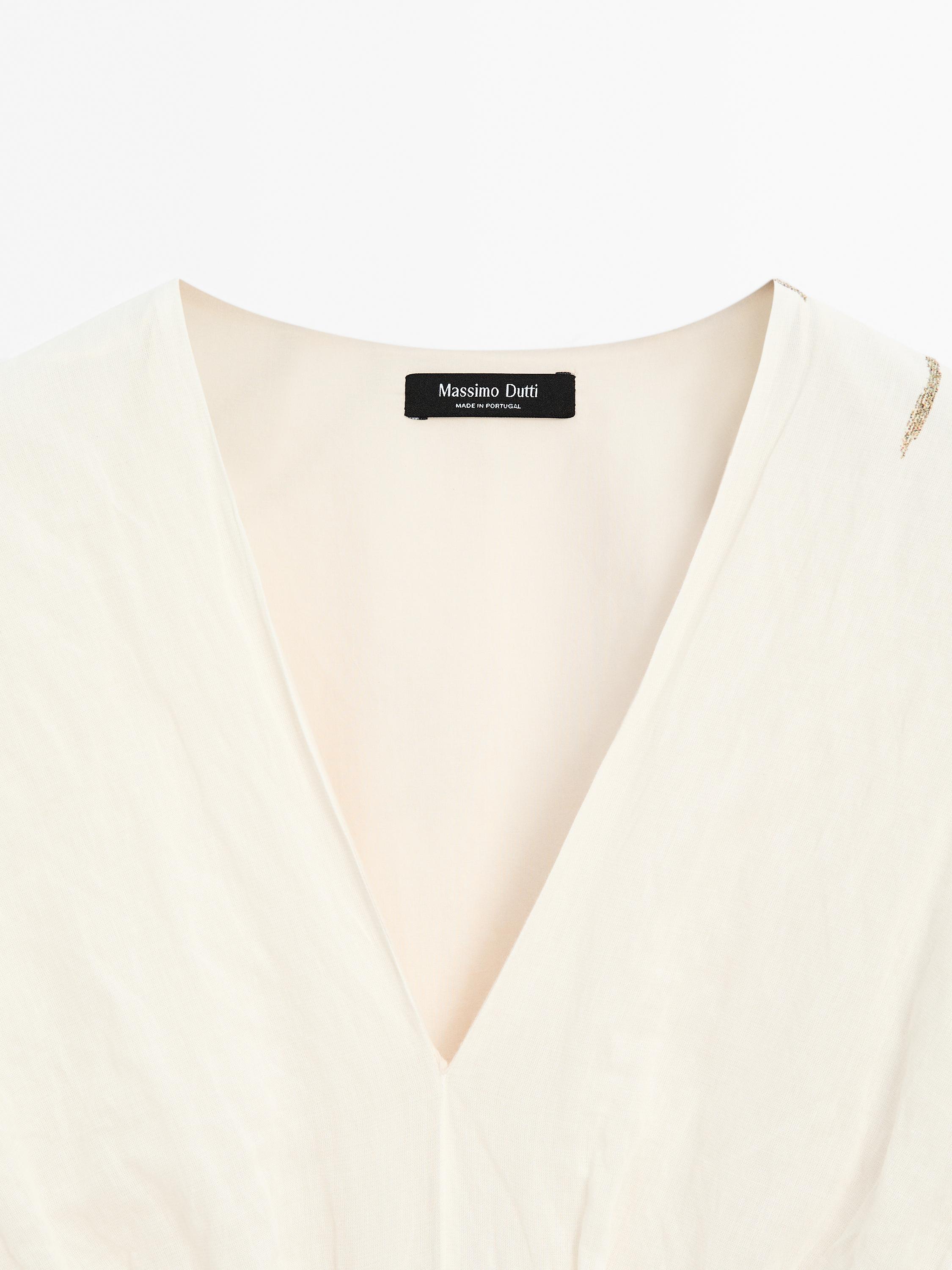 Dress with floral print fabric detail