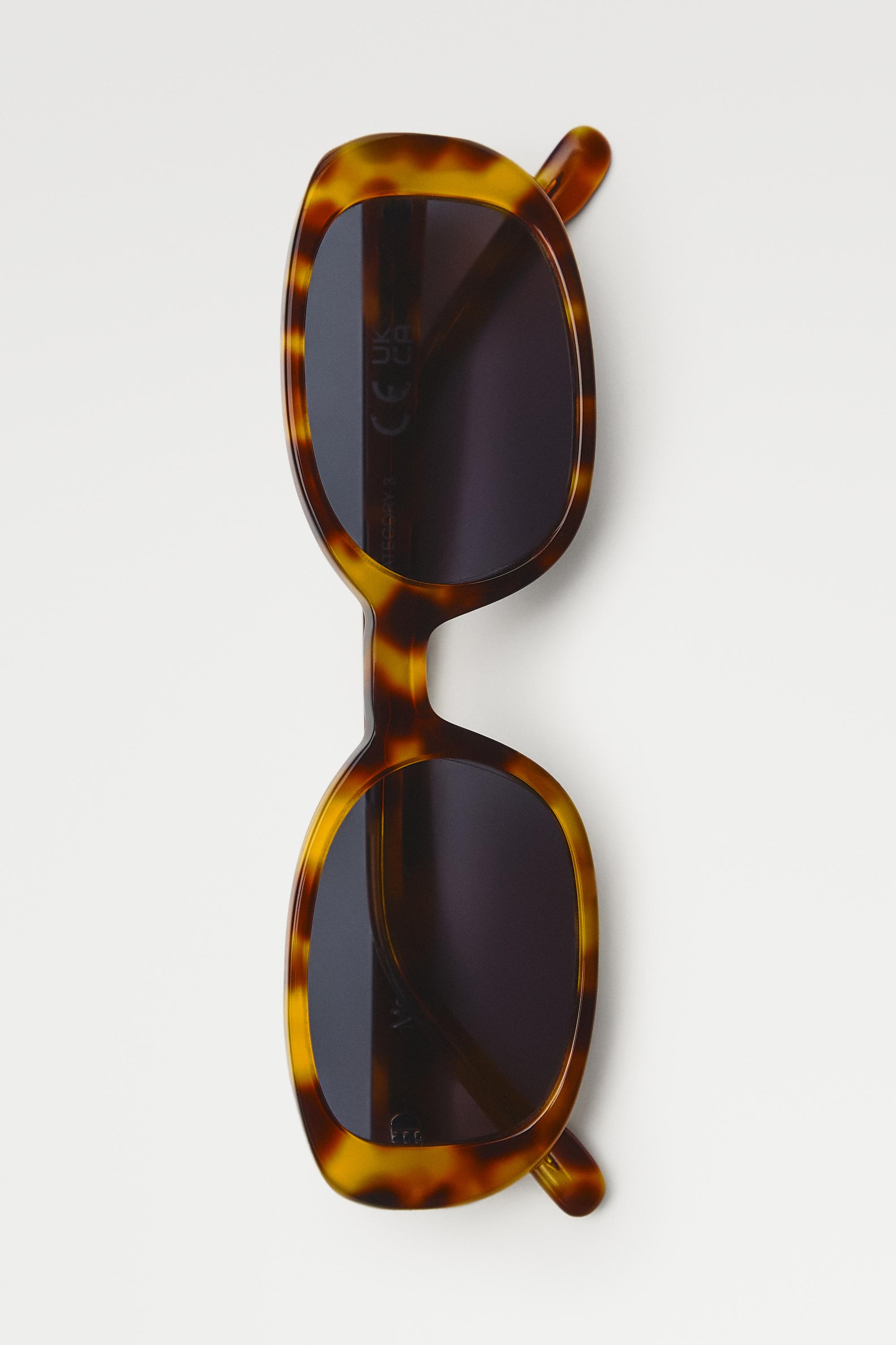 Oval tortoiseshell-effect sunglasses — Light Blue