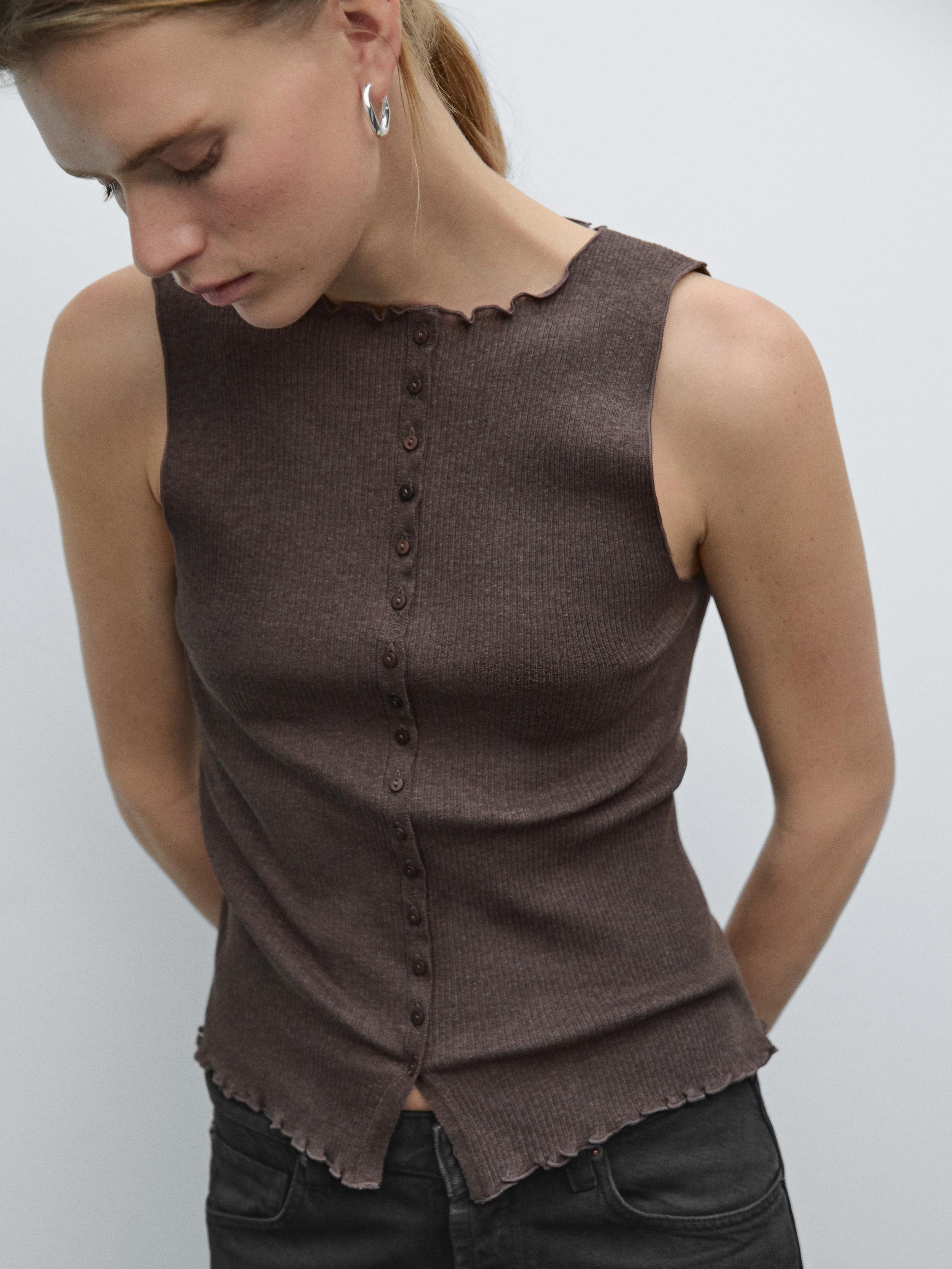 Knit waistcoat top with buttoned strap