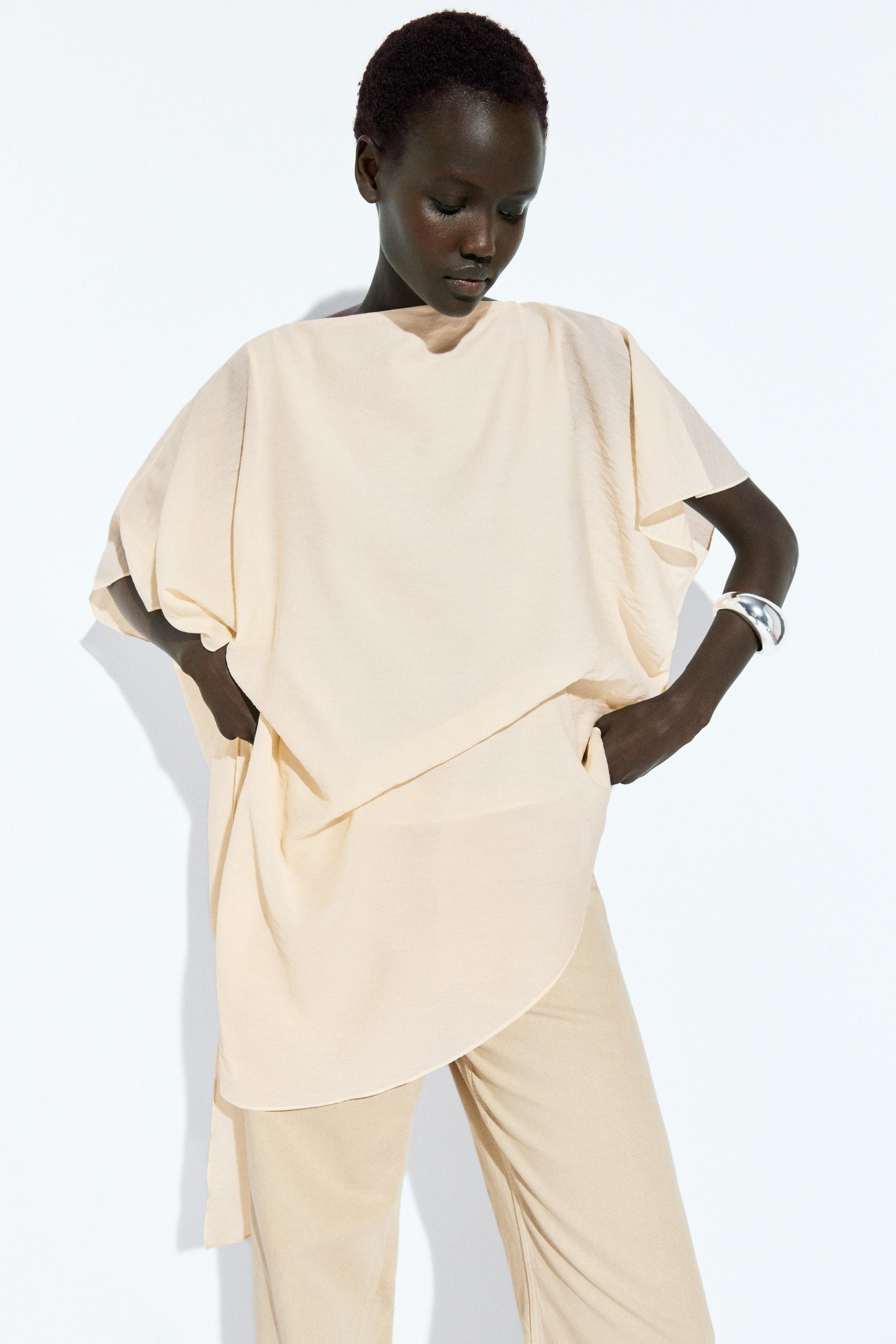 Asymmetric cape-style flowing blouse — Off white