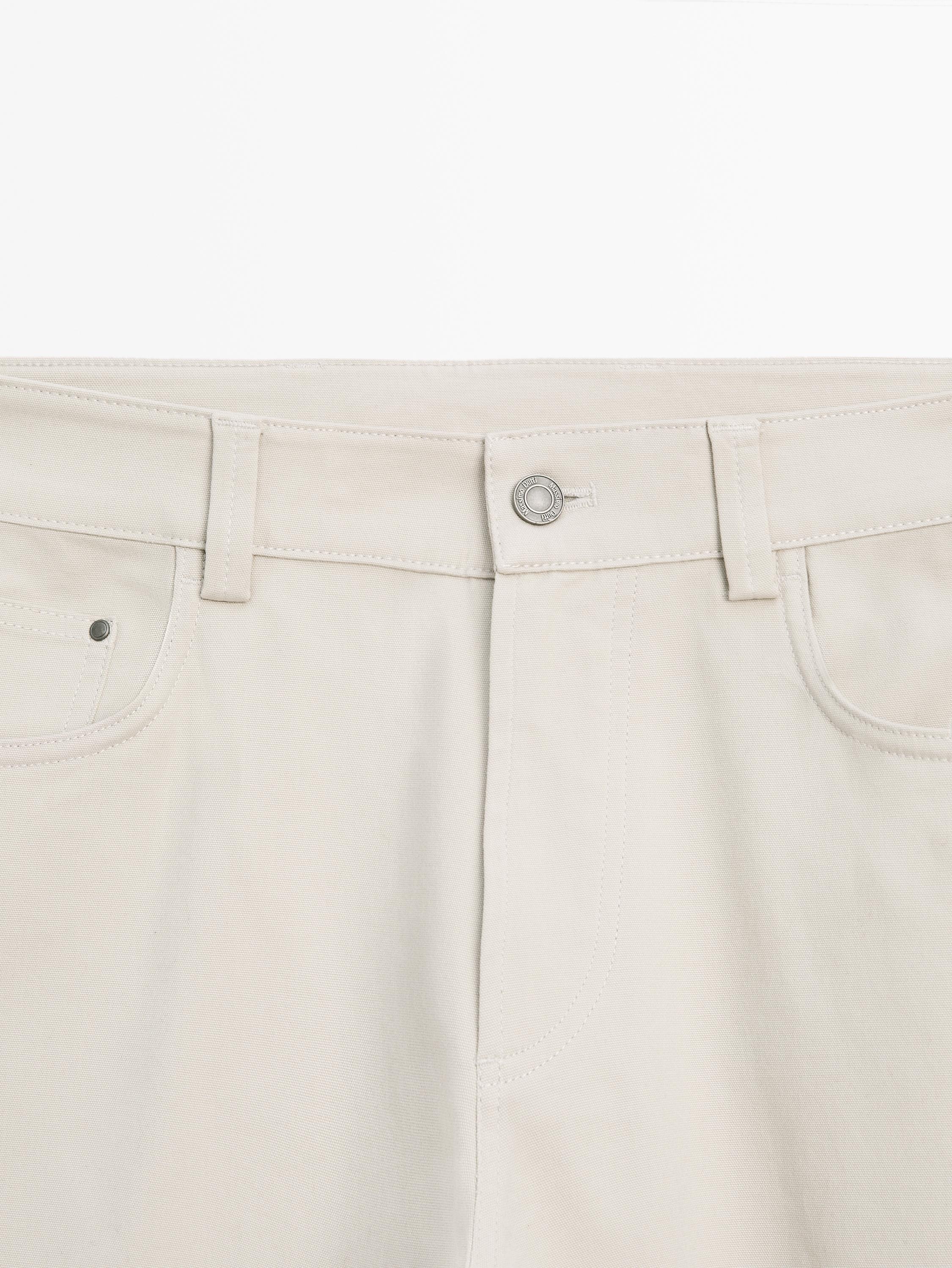 Cotton blend tapered fit jeans