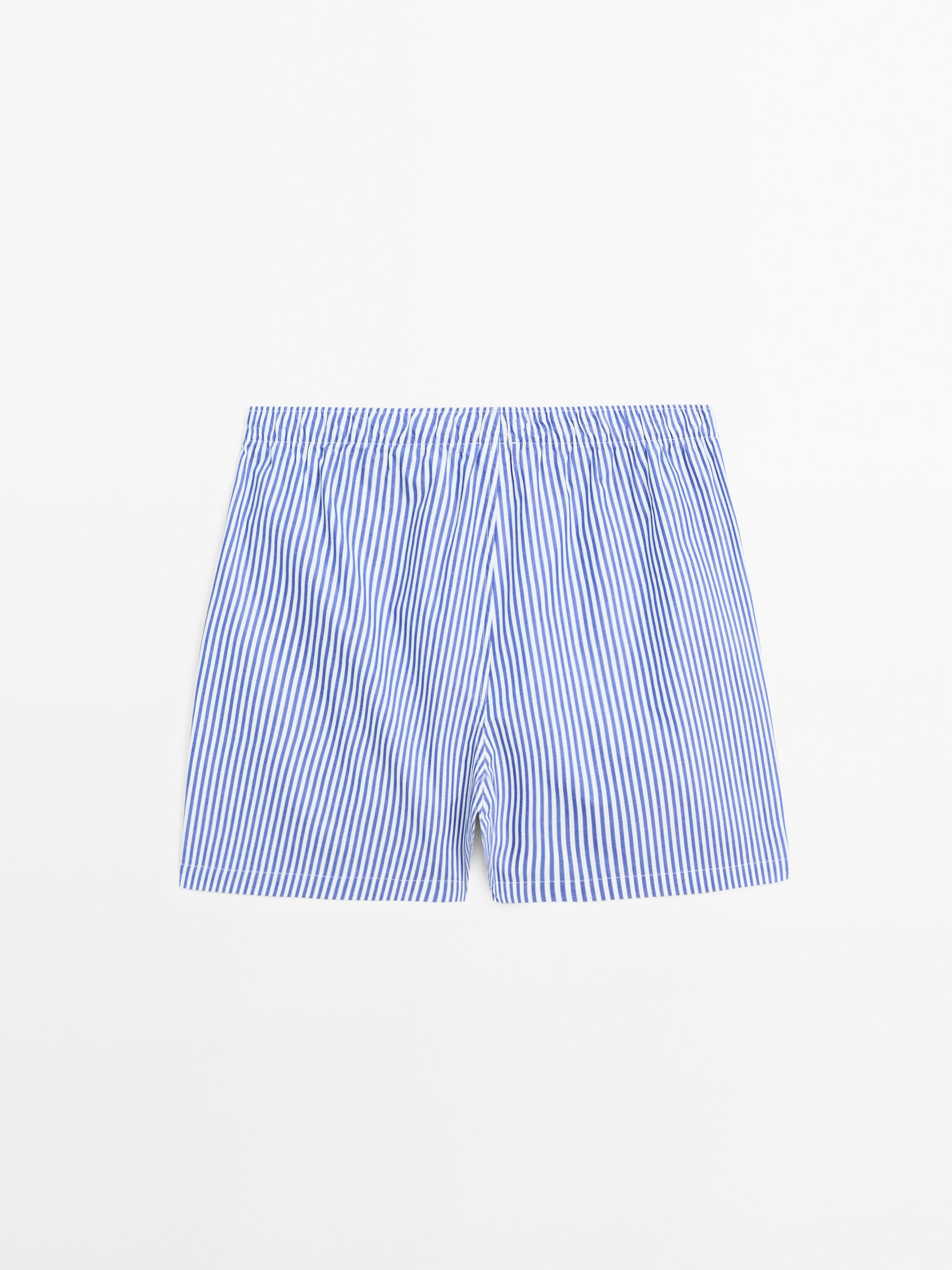 Short sleeve pyjama top and striped trousers
