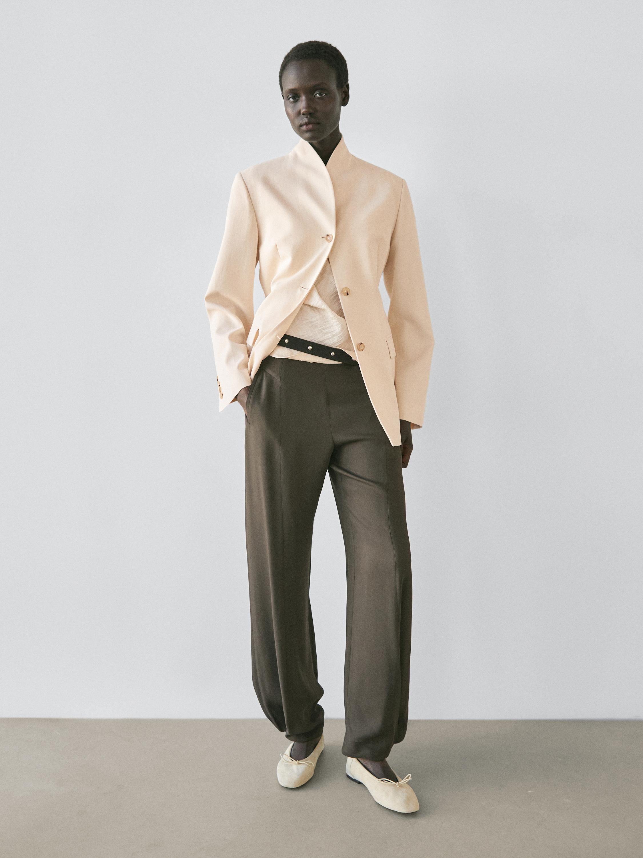 Beige button-up jacket and straight-leg grayish-green pants set.