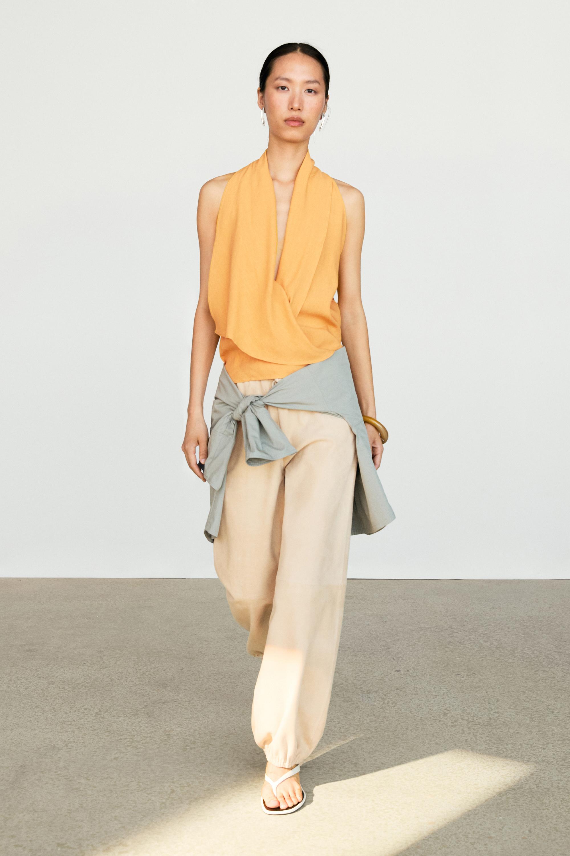 Flowing halter top with ruffle detail