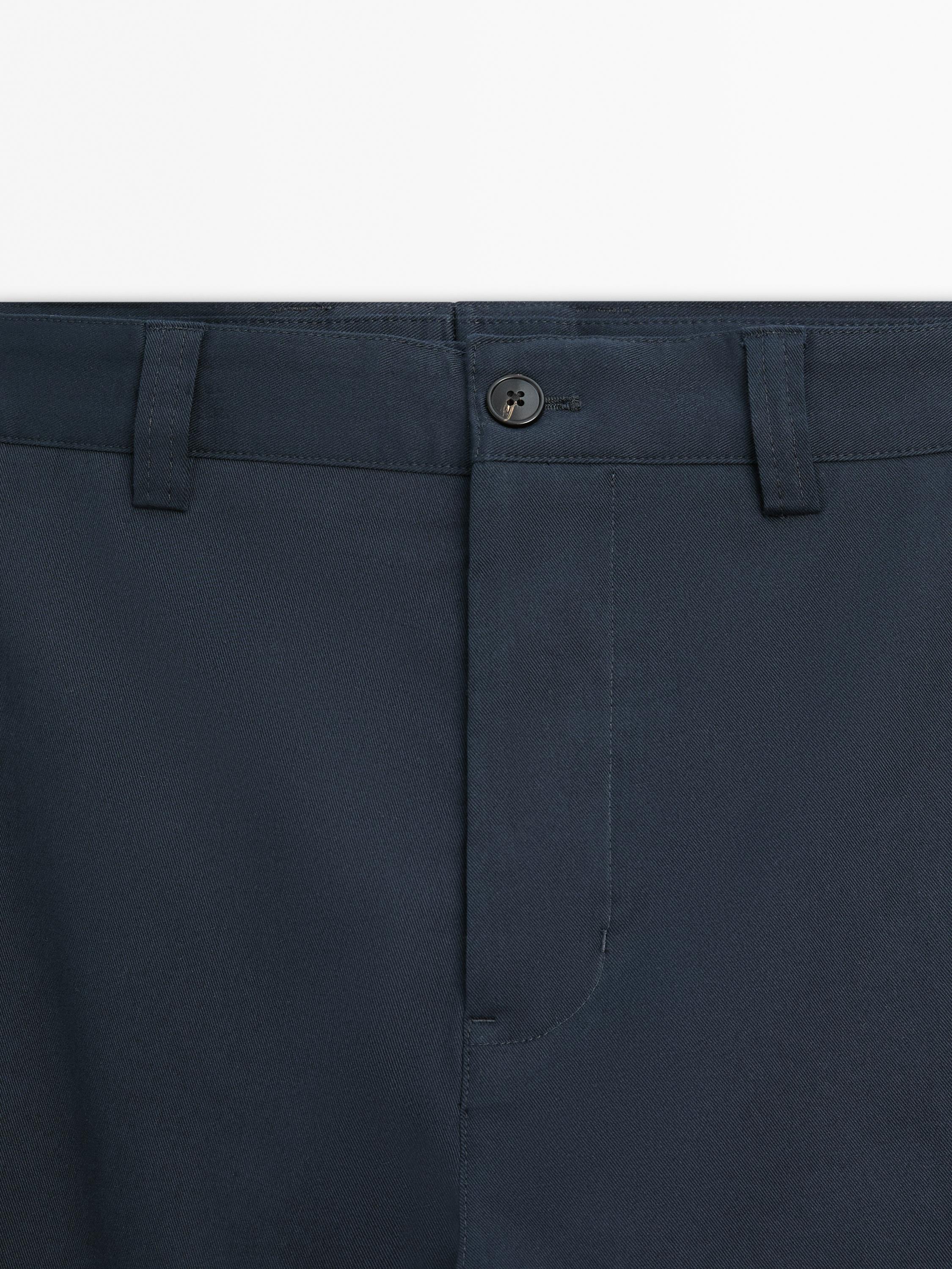 Slim fit cotton blend trousers.