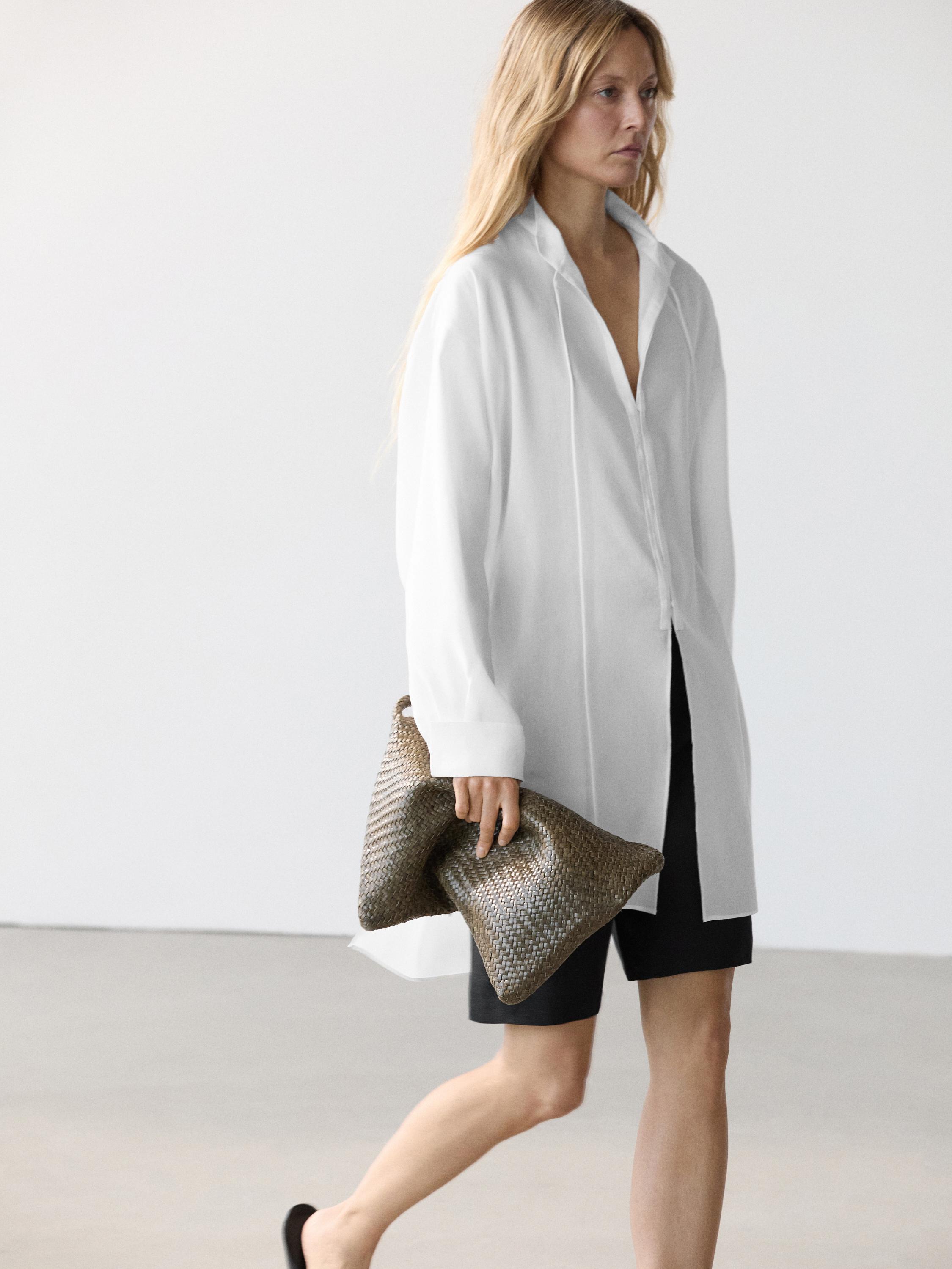 White mandarin collar shirt and black shorts set.